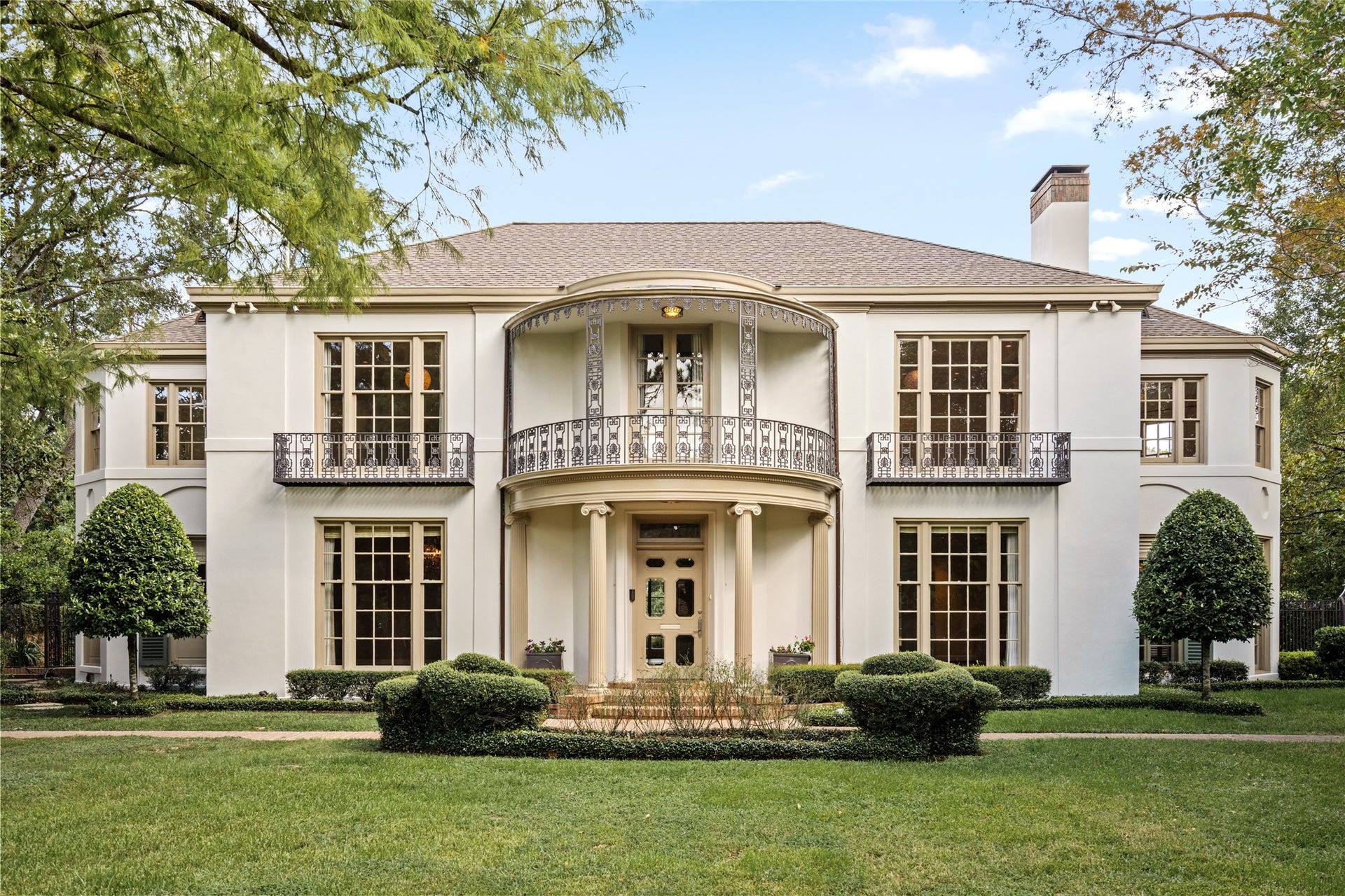 Welcome to 3414 Del Monte Drive, where timeless architecture, graceful symmetry, and an elegant curved balcony create a distinguished first impression.  Framed by mature trees and manicured landscaping, the stately facade sets the tone for this exceptional River Oaks residence.