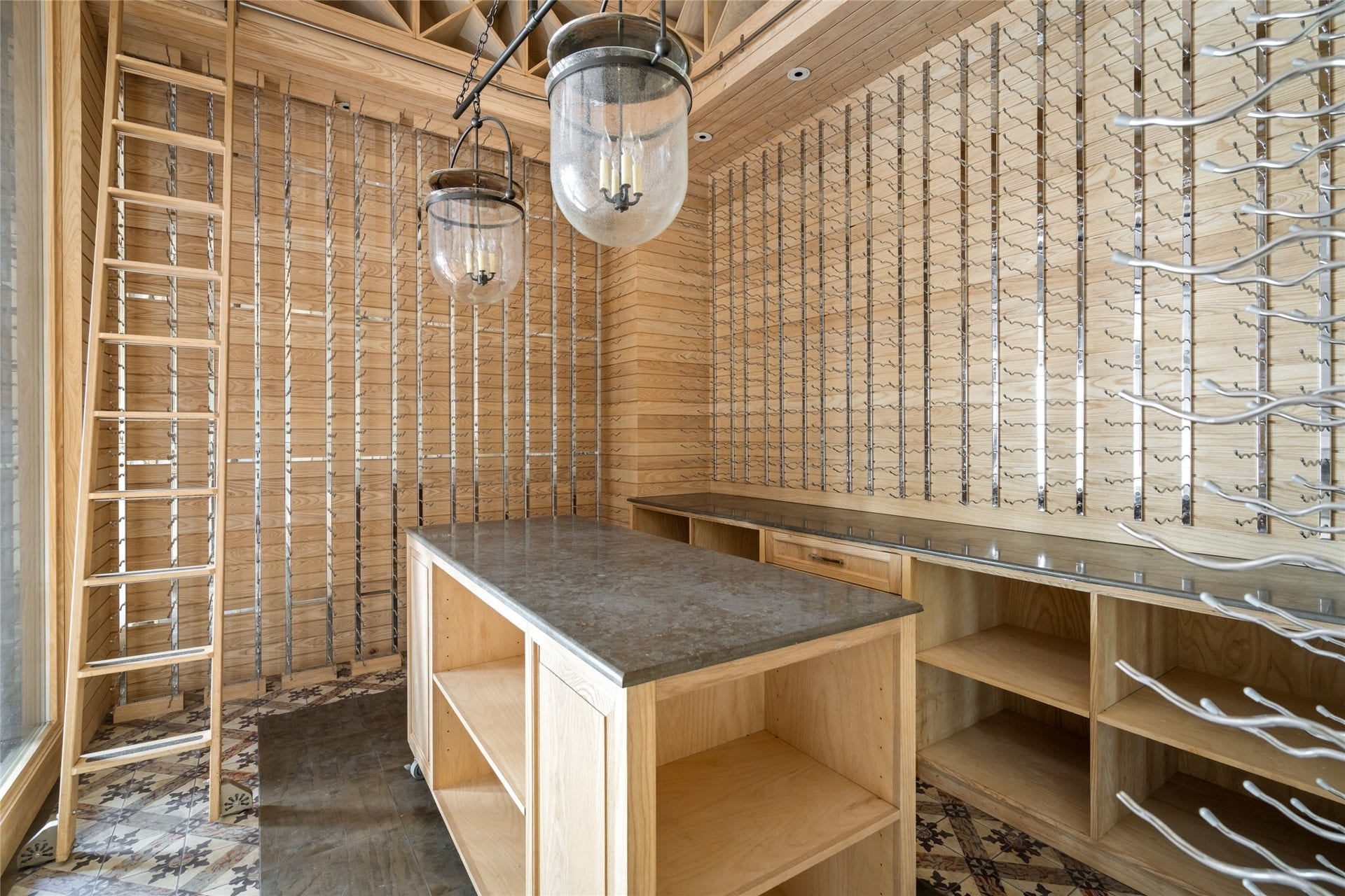 Elegant wine cellar with custom wood shelving, sleek metal racks, and a stylish center island, perfect for showcasing your collection.
