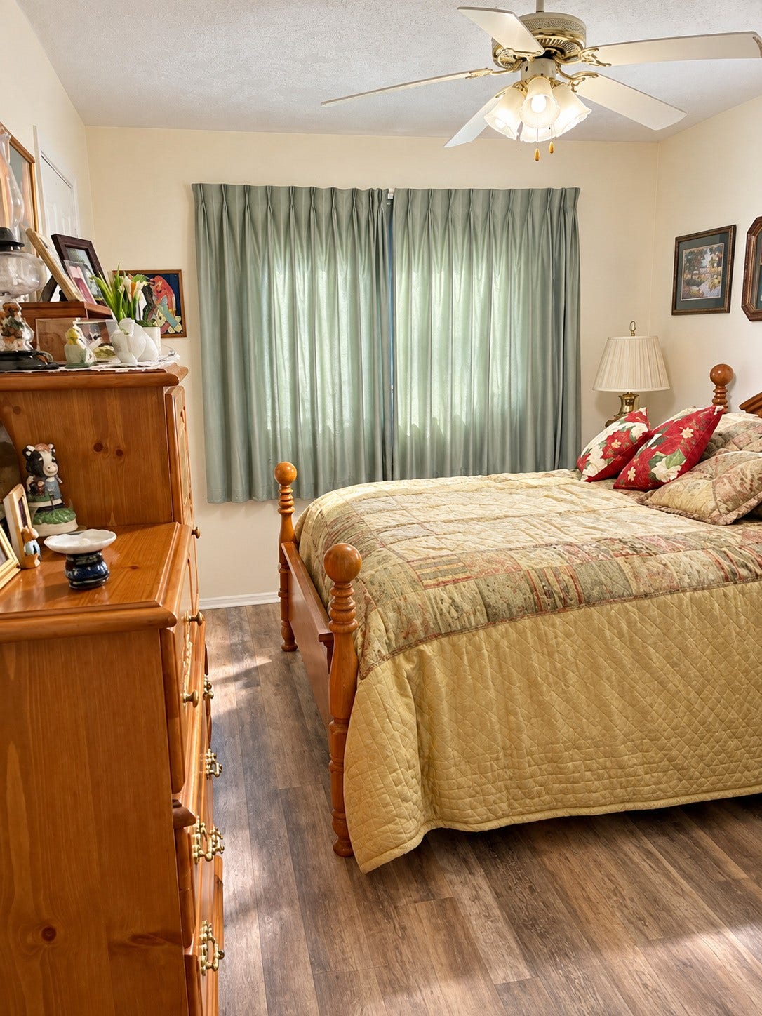 17555 Methil Drive, Spring, TX 77379 Inviting bedroom featuring beautiful wood-look flooring, neutral wall colors, a ceiling fan with lighting, and a large window that allows natural light to fill the space. A comfortable and welcoming retreat with a warm, relaxing atmosphere.