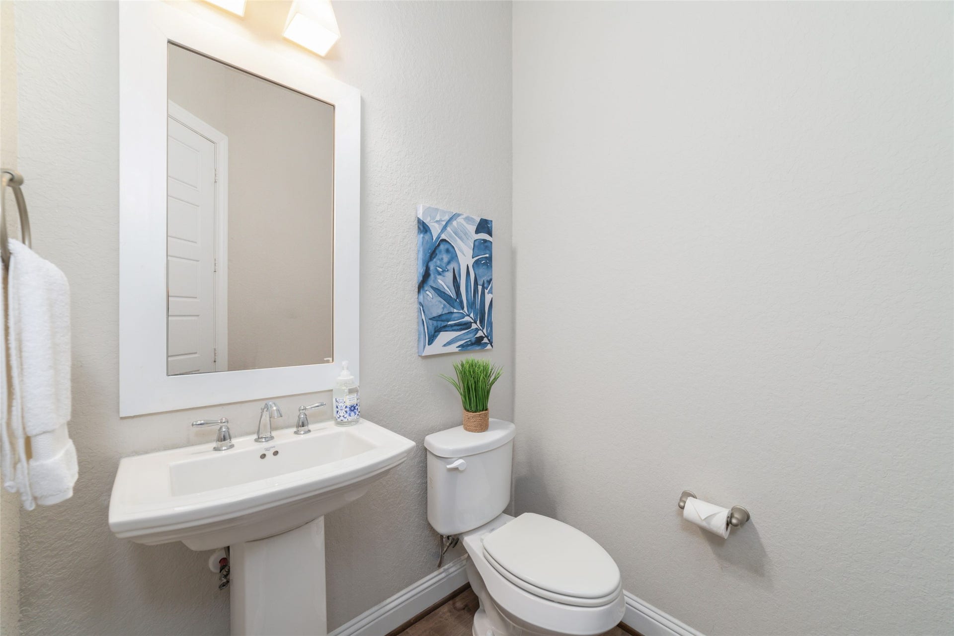 13411 Alpine Mountain Lane, Tomball, TX 77377 Convenient downstairs powder room, tucked away, adjacent to the living area.