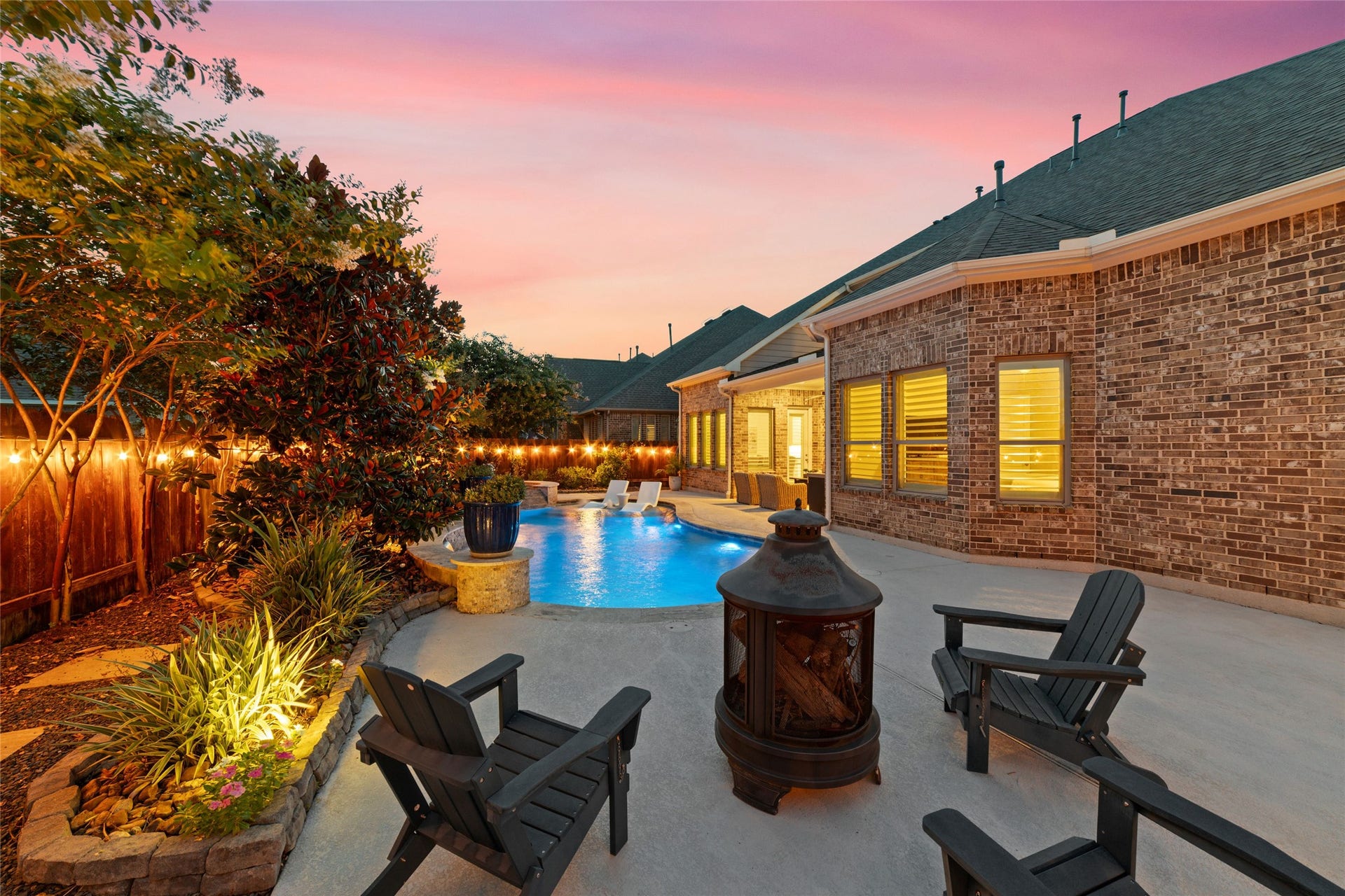 13411 Alpine Mountain Lane, Tomball, TX 77377 End your day enjoying sunset views from this incredible backyard oasis.