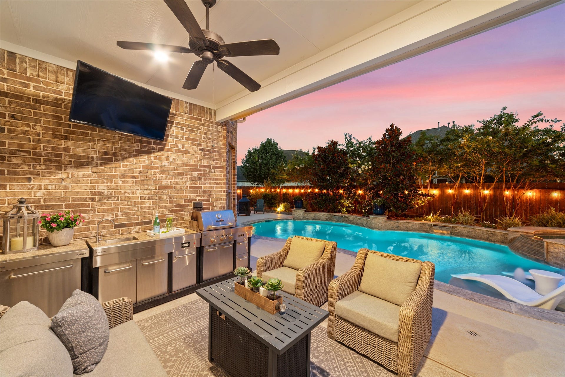 13411 Alpine Mountain Lane, Tomball, TX 77377 Covered outdoor living area with gorgeous views of the pool, creates the perfect evening gathering spot