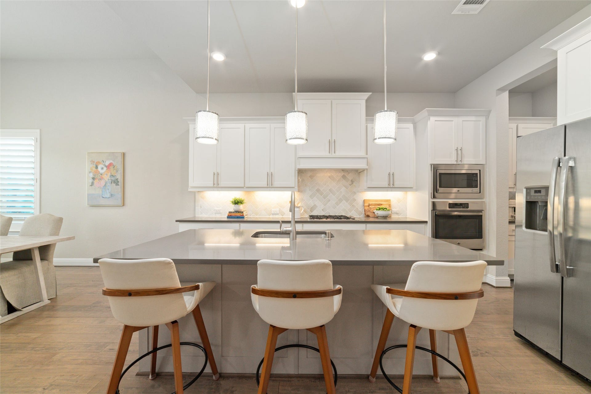 13411 Alpine Mountain Lane, Tomball, TX 77377 Oversized island offers additional seating and prep space.