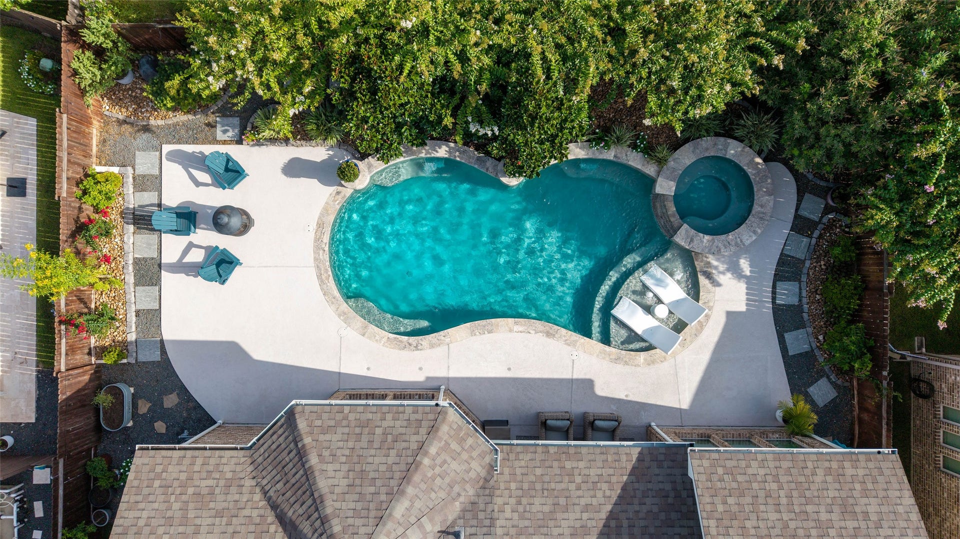 13411 Alpine Mountain Lane, Tomball, TX 77377 The showstopper backyard is a true resort-inspired oasis, complete with a gorgeous pool, spa, outdoor kitchen & covered patio - relax, recharge & entertain in style!