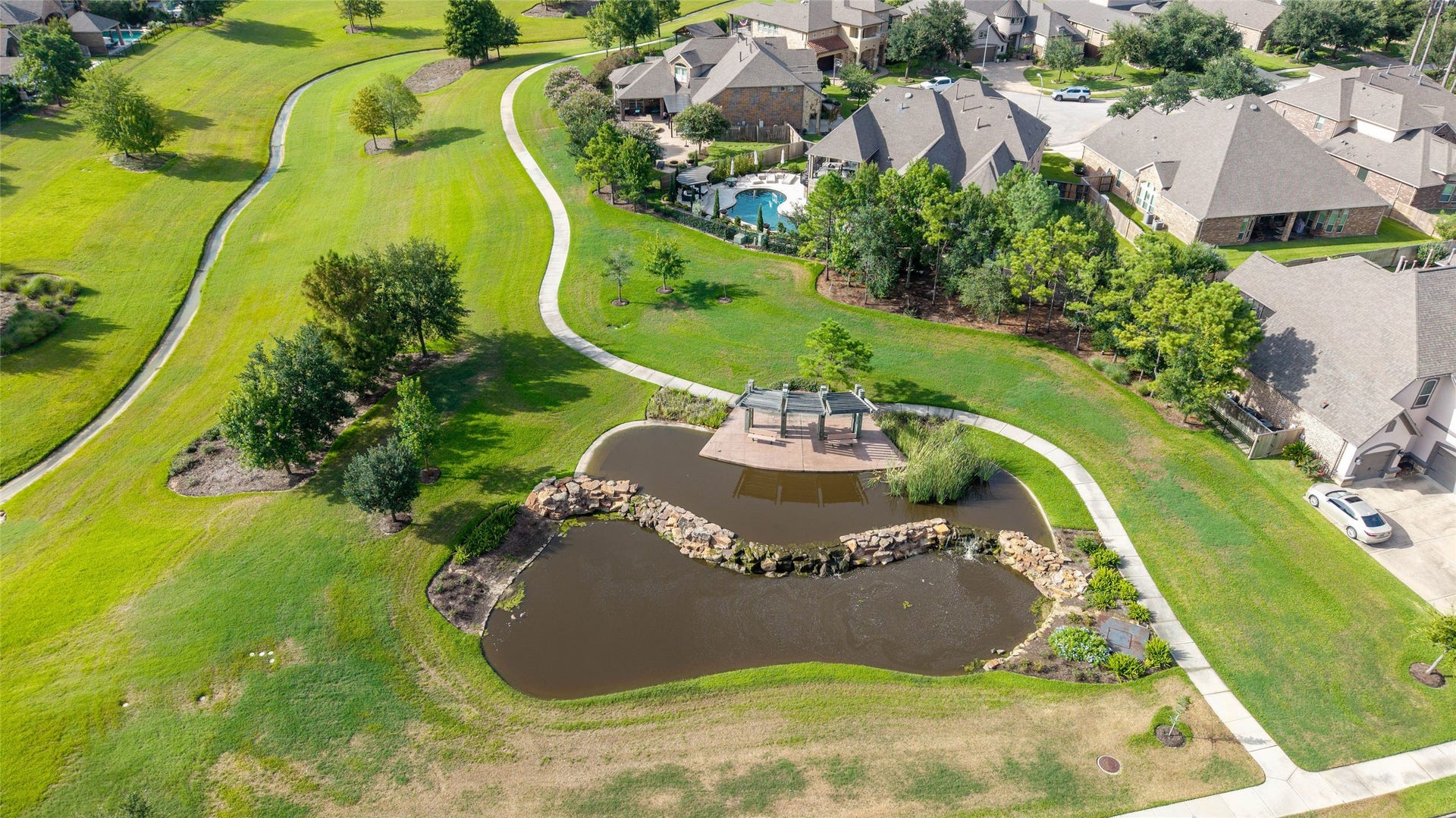 13411 Alpine Mountain Lane, Tomball, TX 77377 Another small lake with a sitting area and scenic walking trails right around the corner.