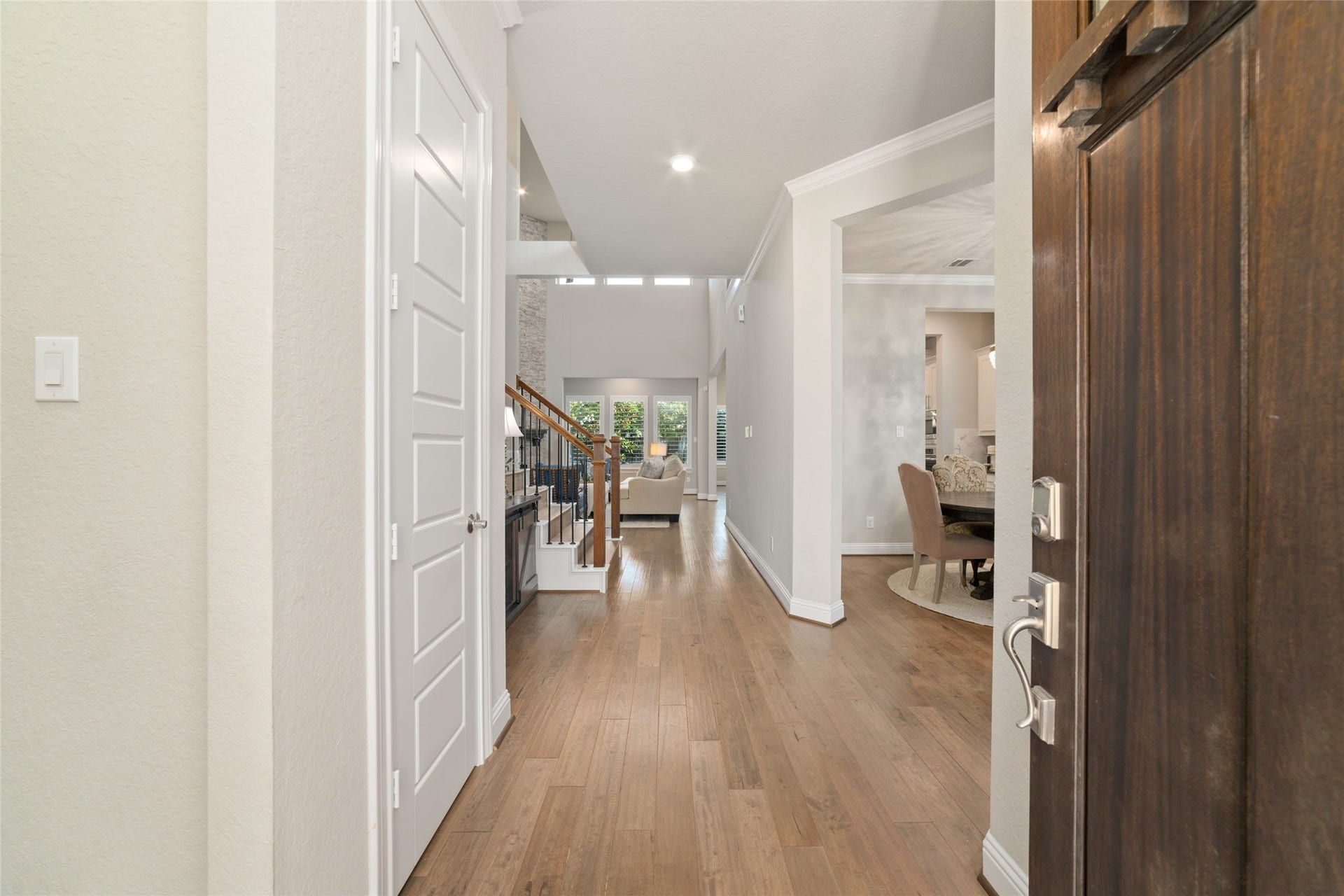 13411 Alpine Mountain Lane, Tomball, TX 77377 The welcoming entry offers a stunning first impression, all hard surface flooring throughout, you're greeted with the home's open layout to the soaring living room and expansive wall of windows that flood the space with natural light.