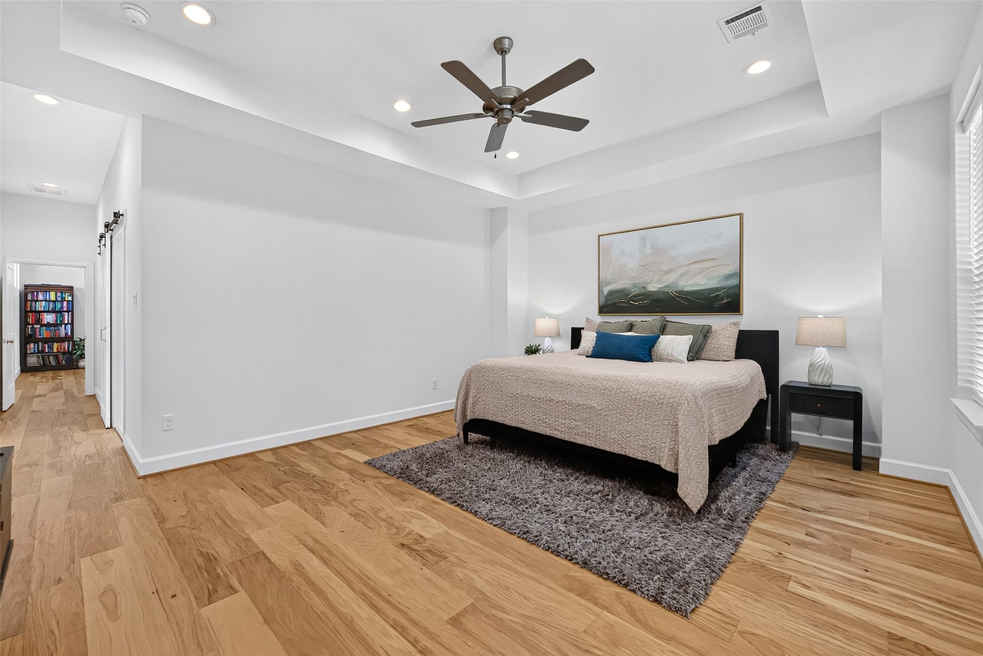 1201 E 23rd Street, Houston, TX 77009 On the far side of the flex space, towards the back of the home, is the primary bedroom that easily accommodate a king size bed with room for a seating area.
