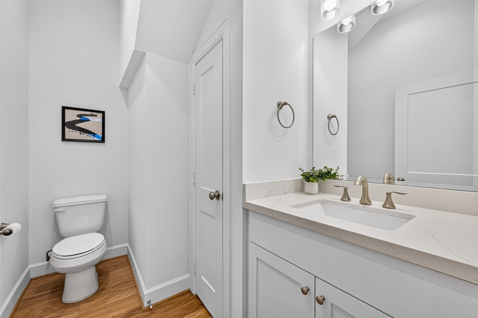 1201 E 23rd Street, Houston, TX 77009 To the left of the stairs is a convenient half bath.
