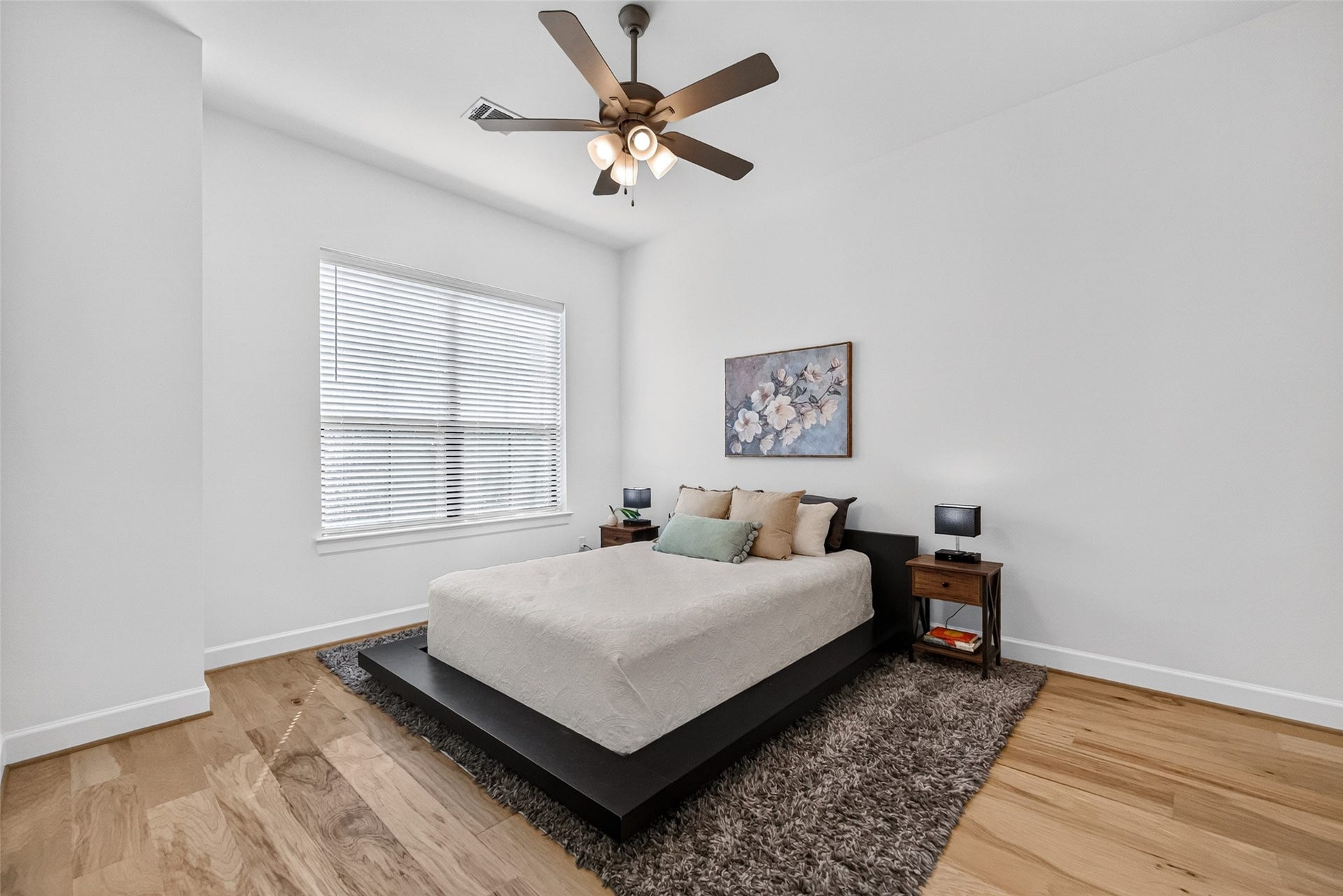 1201 E 23rd Street, Houston, TX 77009 As you continue through the bathroom you'll find the third bedroom. This bedroom gets lovely natural light through the large window that faces the beautiful oak tree in the front.