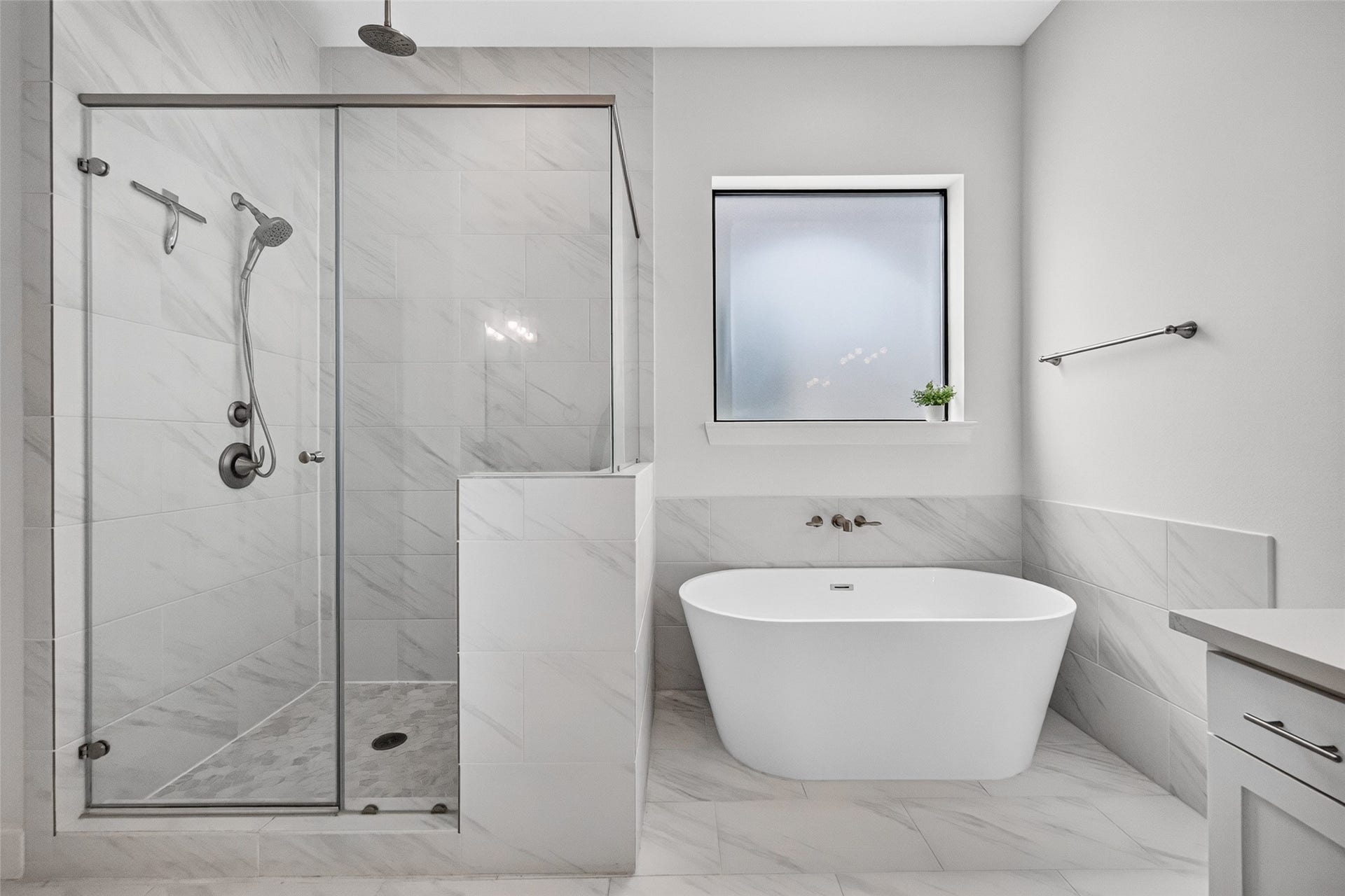 1201 E 23rd Street, Houston, TX 77009 The bathroom also features a walk-in closet and a freestanding soaking tub. Just to the left of the shower, youll find a large closet.