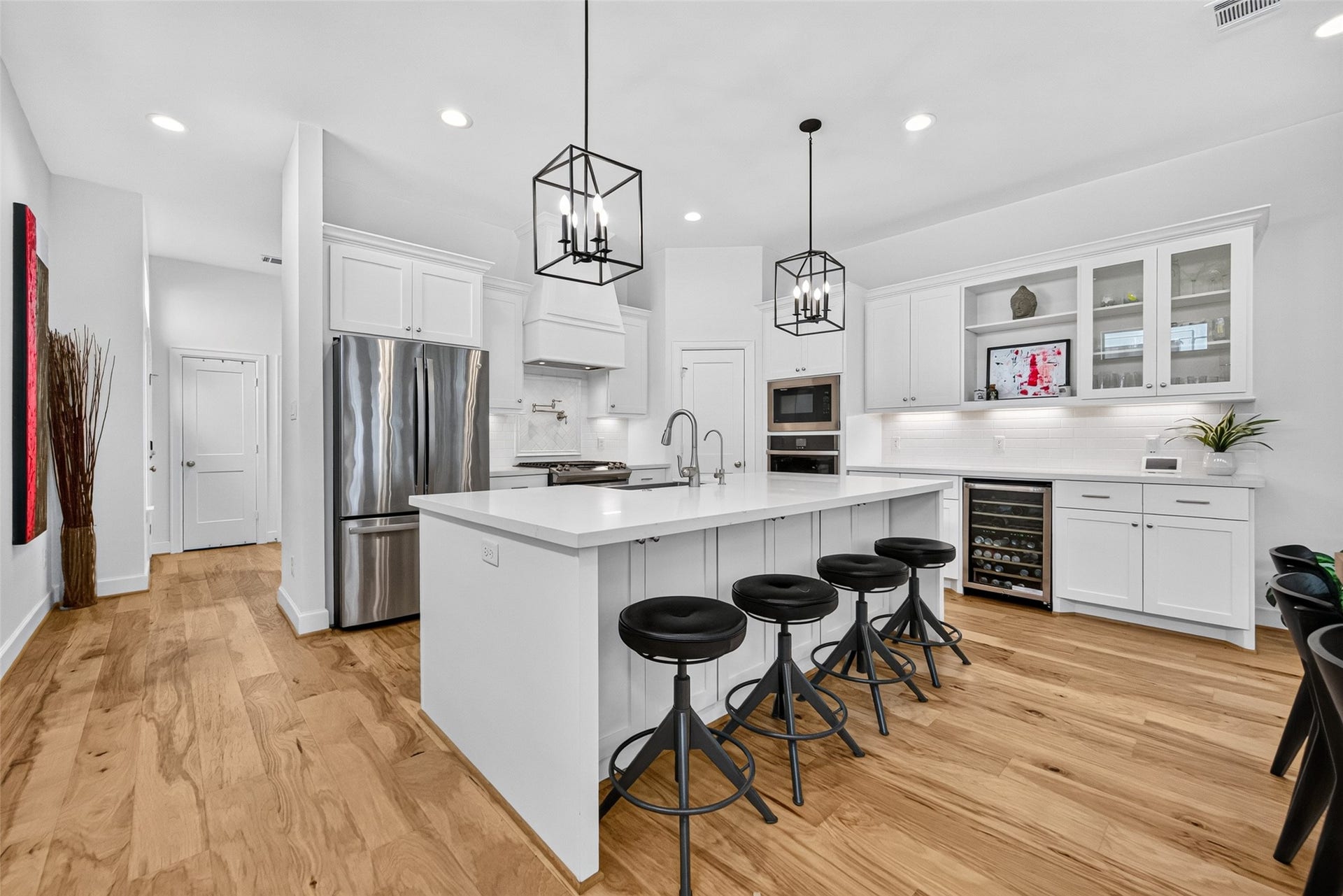 1201 E 23rd Street, Houston, TX 77009 As you head back towards the stairway, you'll get another view of the island that easily seats 4 and features an abundance of storage including cabinets on the stool side.