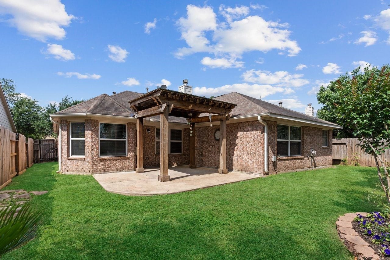 7207 Palmito Ranch Drive, Richmond, TX 77406 This is all Brick One Story Home with Gutters all around! Lush Landscaping and amazing Covered Patio!