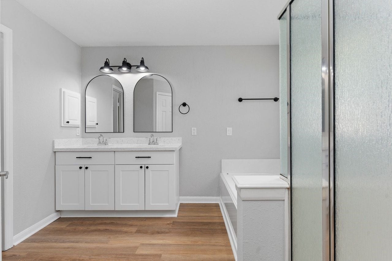 7207 Palmito Ranch Drive, Richmond, TX 77406 The Spa Like Primary Suite Bathroom just for you! Features upgrade Custom Vanity with Upgrade Quartz Countertops, Deep two Undermount Sinks, Custom Mirror and more!