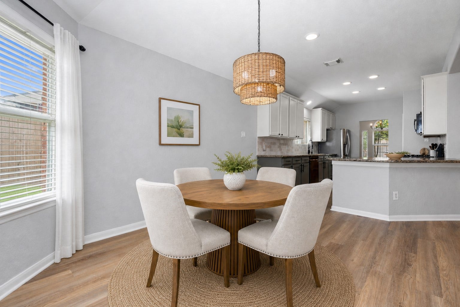 7207 Palmito Ranch Drive, Richmond, TX 77406 The casual dining area flows seamlessly into the gourmet kitchen, highlighted by beautiful new flooring that enhances the open-concept design. It's the perfect space for everyday living and entertaining family and friends. Virtually Staged