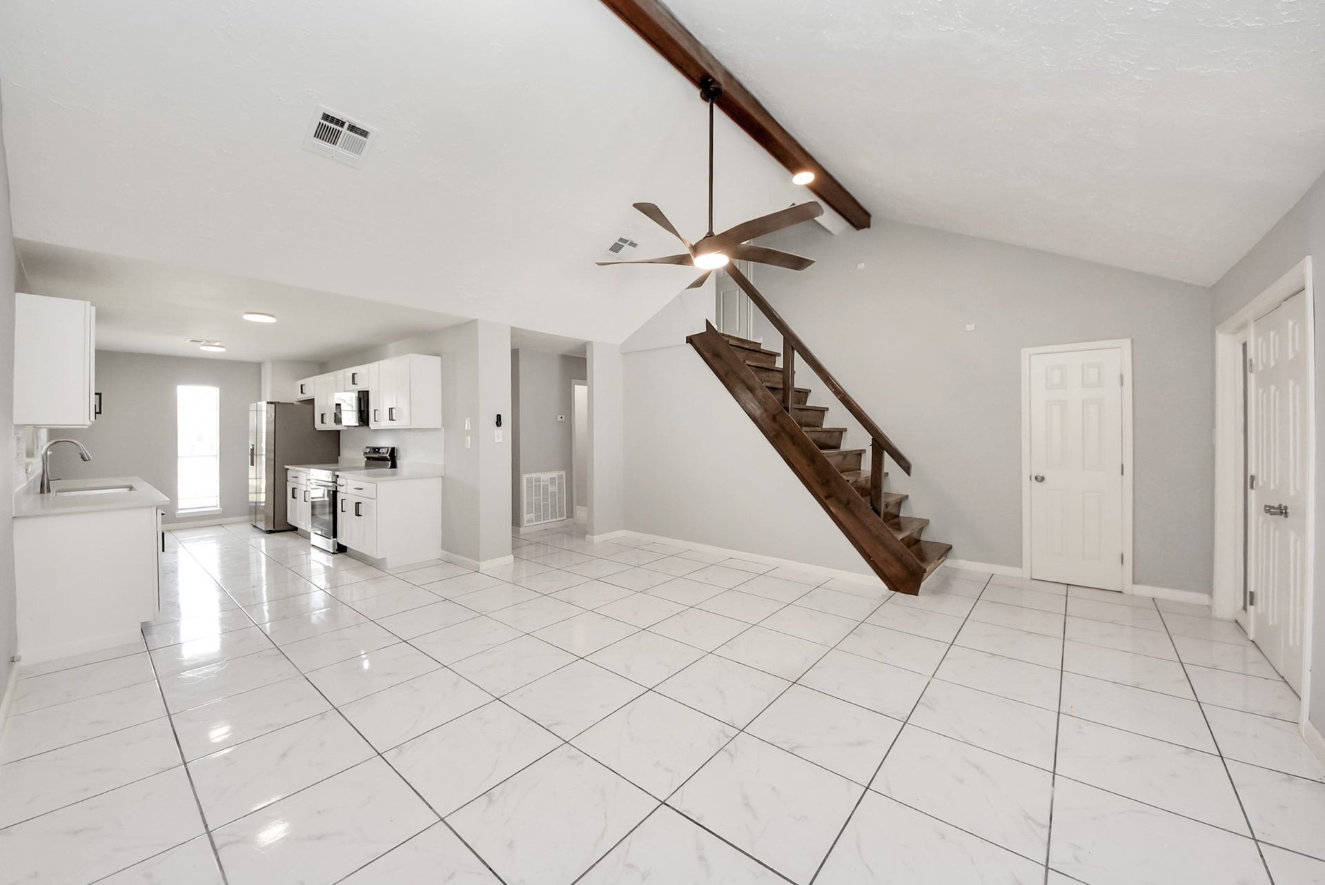 Full view of Living Room, Staircase and Kitchen