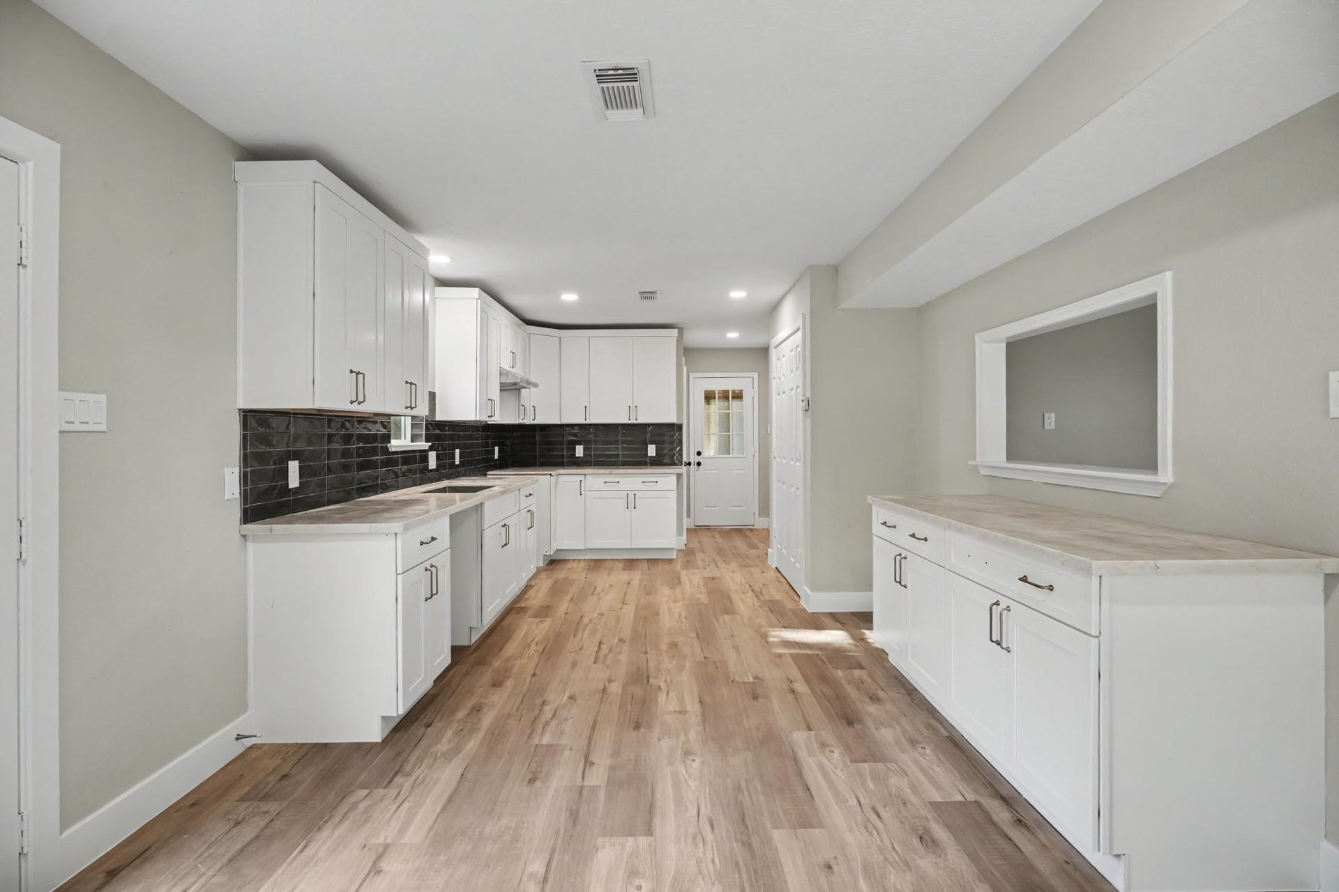 1021 27th Street, Dickinson, TX 77539 Extra counter space in kitchen with view into living room
