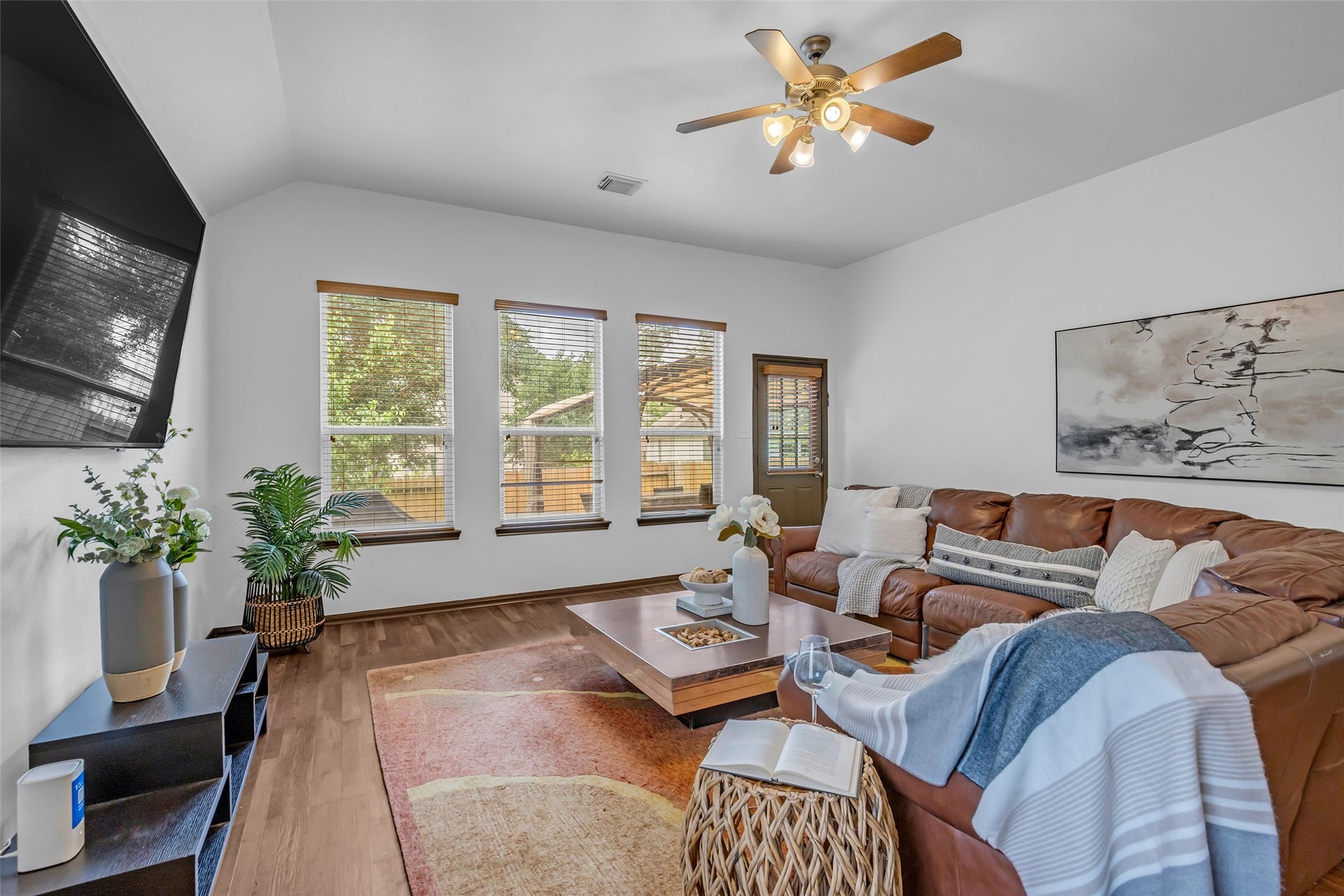 134 S Star Ridge Circle, The Woodlands, TX 77382 Large windows bring abundant natural light into the living space.