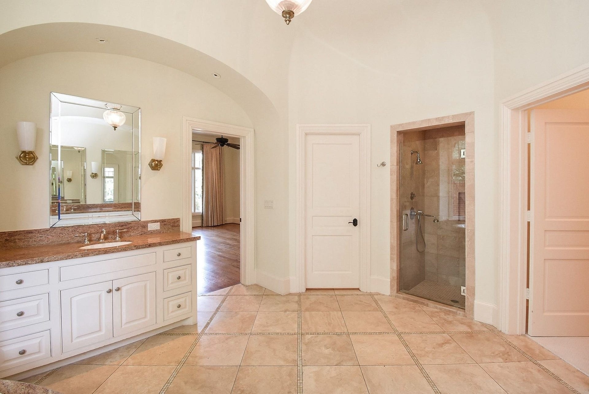 Private water closet and separate walk in shower glass enclosure