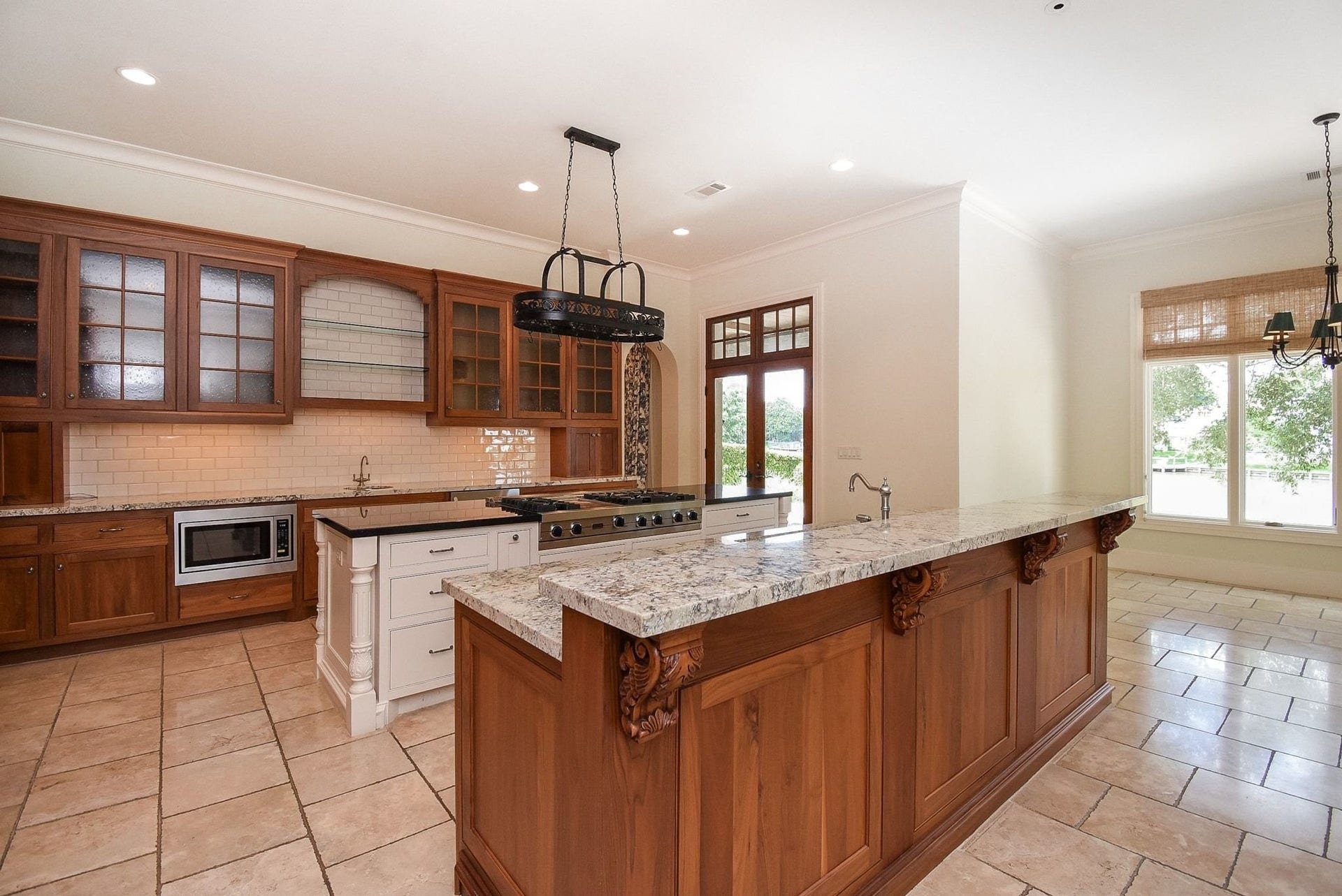 Cabinetry with glass fronts and built in shelves to show off your plate collection.  See the doors?  That leads to your covered patio overlooking the water we will see when we go back outside