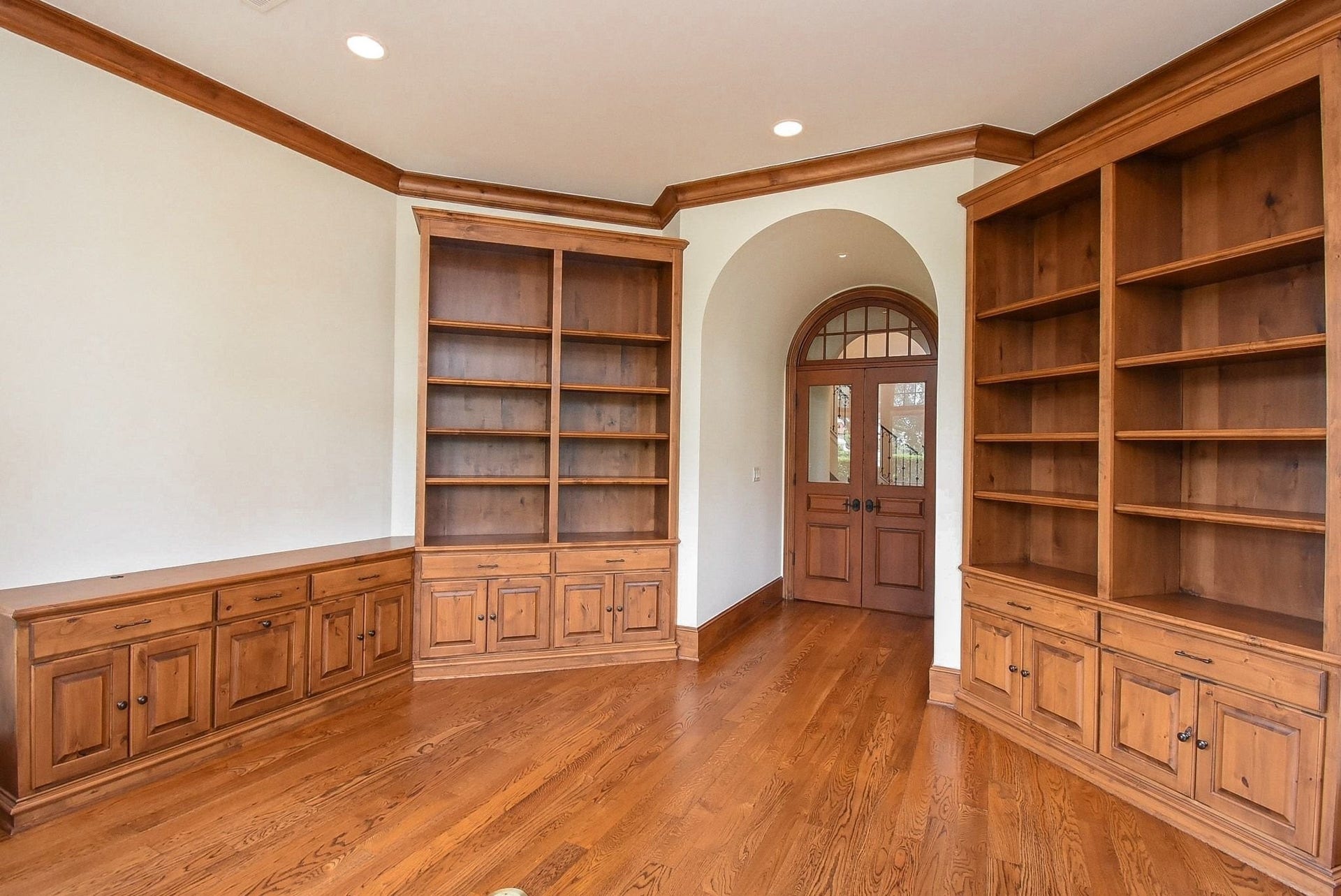 The office/study is right off of the entry also featuring those beautiful real wood floors and crown molding