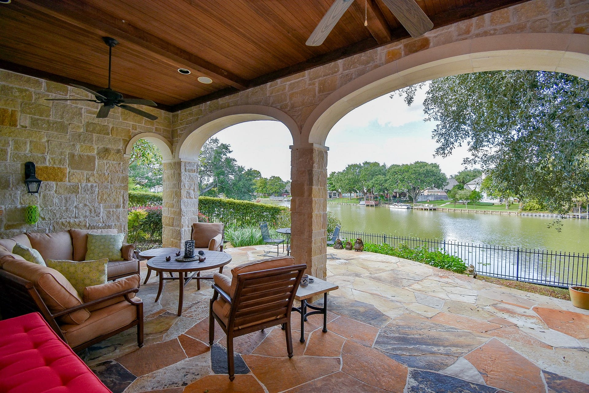 As promised, here is the patio and outdoor kitchen.  Don't you love the wooden ceiling complete with fans