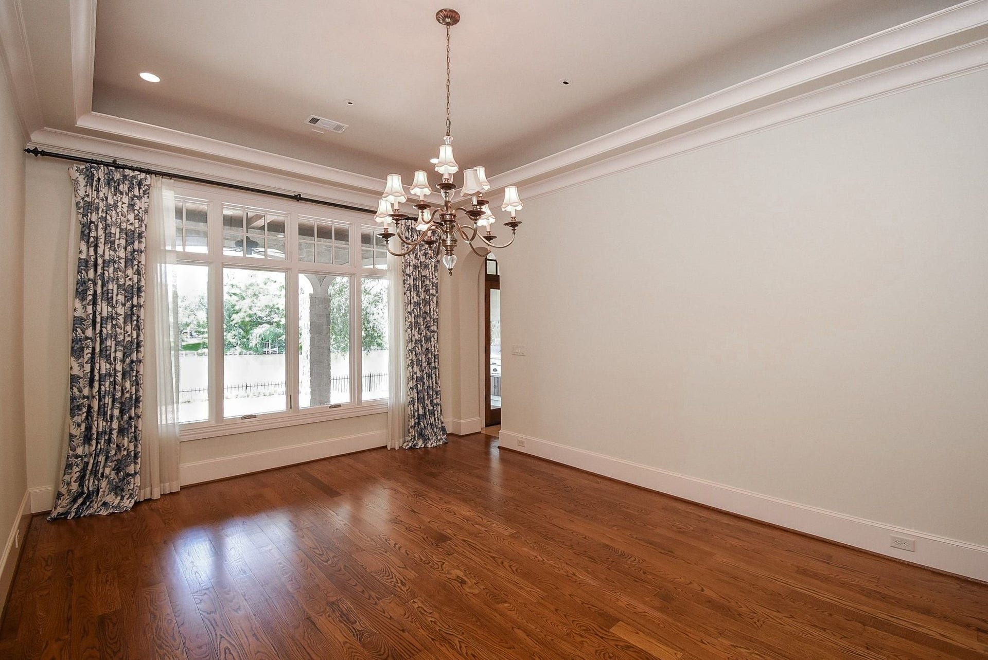 Formal Dining room is extra large with room for your large furniture.   The wall of windows with views of the covered patio and  water.   Perfect entertaining set up with indoor and outdoor dining options