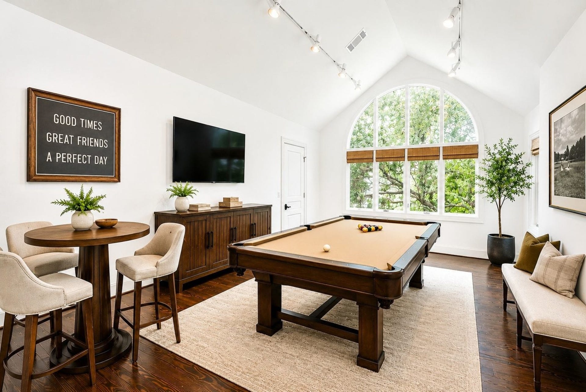 Staged as a game room, this incredible room was an art studio for owner  Custom designed with overhead and natural lighting, this would make a great craft room too