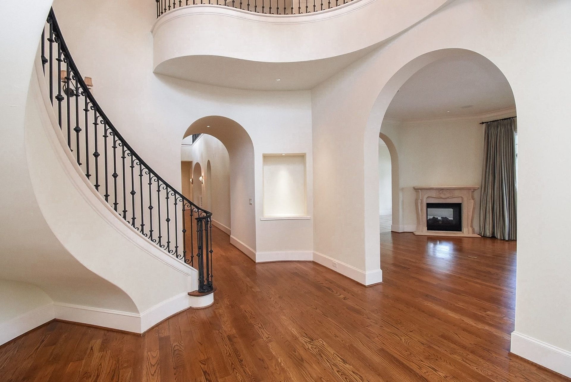 As you enter the front door, you are greeted by this formal entry and the elegant winding staircase.