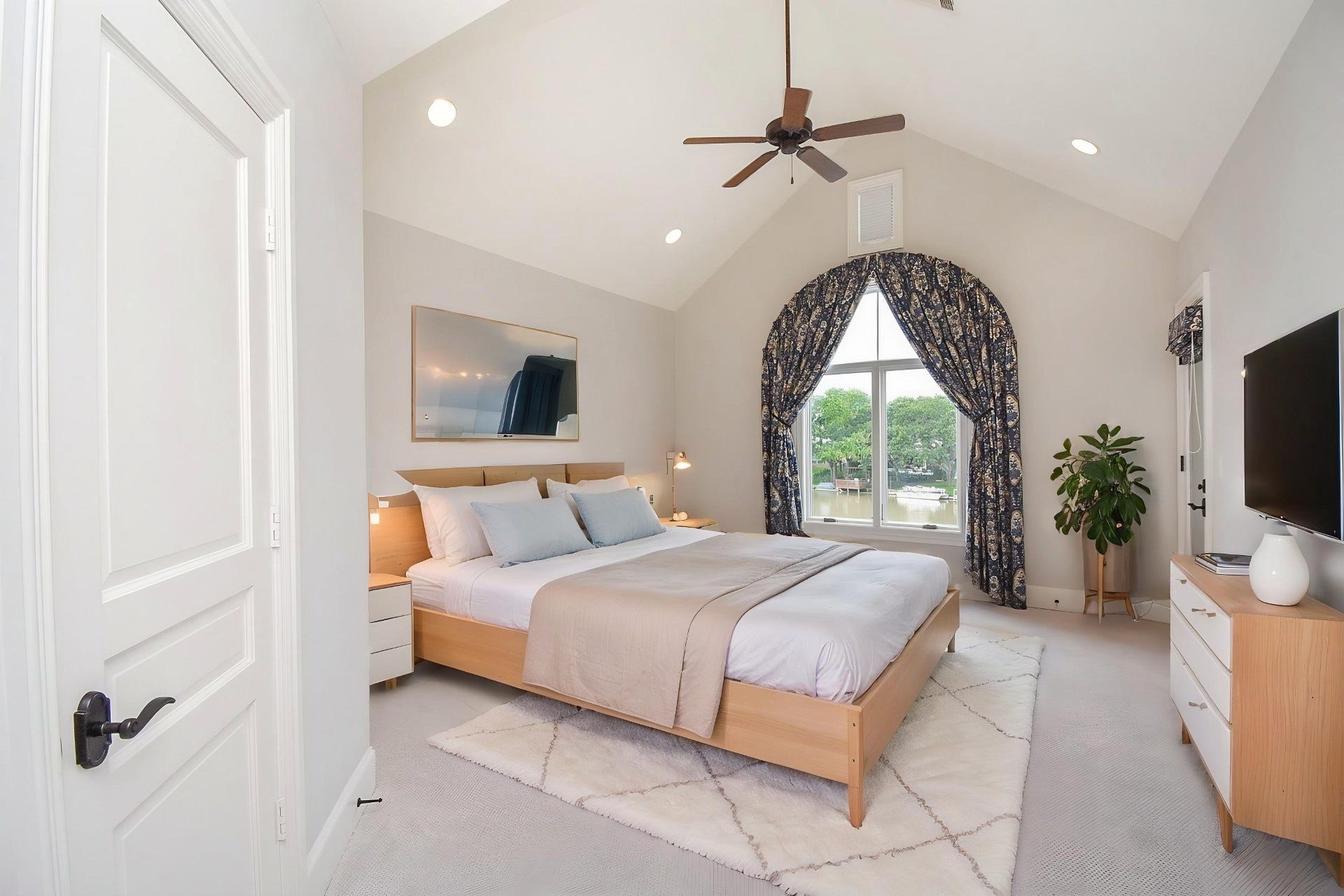 Bedroom 3 virtually staged has access to the private patio through door on the right