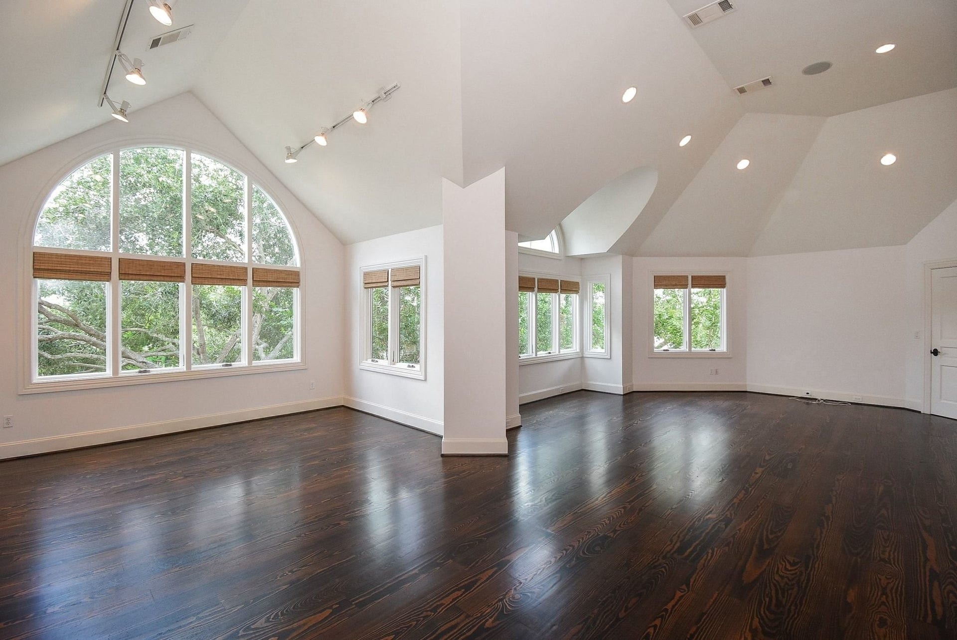 This fabulous room has a game room/art studio on the left and a 2nd home office/study upstairs.  Complete with great overhead recessed lights, tons of windows all overlooking the back of the home and water