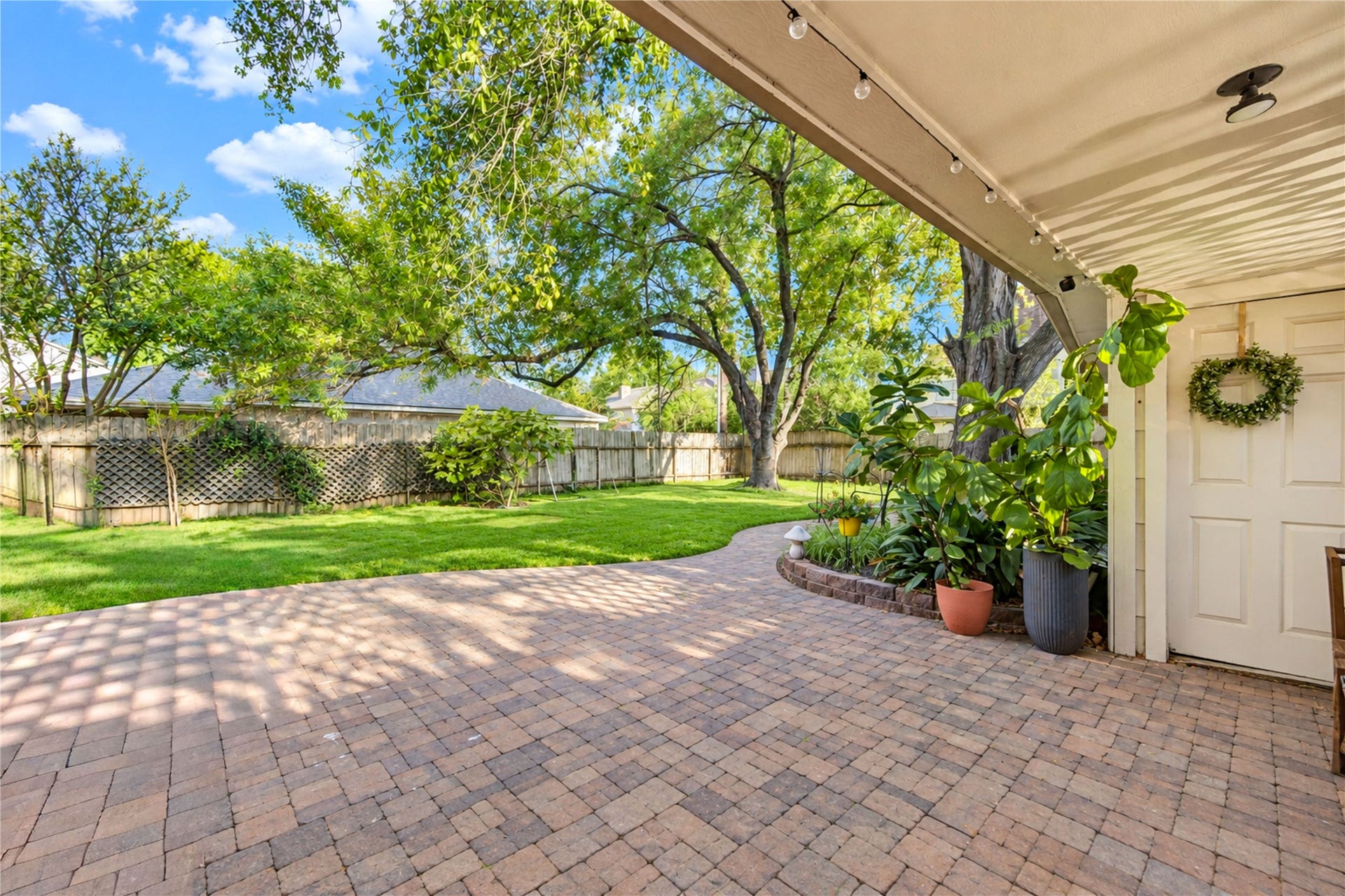 11423 Inwood Drive, Houston, TX 77077 Step outside and embrace the beauty of outdoor living! This expansive brick paver patio offers endless possibilities for alfresco dining, morning coffee or relaxed weekend entertaining. With lush green lawn, mature shade trees and beautiful backyard views, this inviting space feels like a private retreat. Whether hosting a lively gathering or savoring a peaceful afternoon, there's plenty of room to enjoy the outdoors in comfort and style!