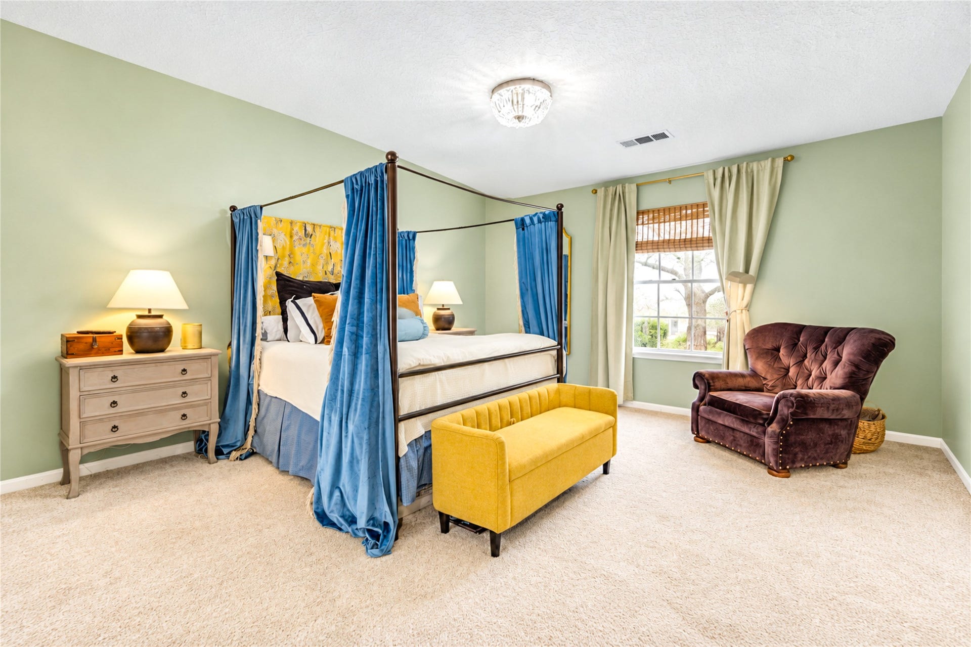 11423 Inwood Drive, Houston, TX 77077 Escape to your own private retreat! This spacious second-floor primary bedroom offers a peaceful blend of comfort and designer charm, featuring soft, soothing wall colors, abundant natural light and plenty of room to relax. The elegant canopy bed showcases the room's generous proportions, while thoughtfully curated details create a serene atmosphere. The perfect place to unwind after a busy day and wake up feeling refreshed!