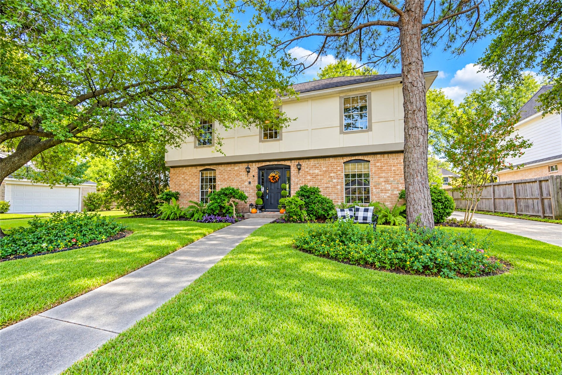 11423 Inwood Drive, Houston, TX 77077 Picture-perfect curb appeal welcomes you home! This charming two-story home blends classic brick architecture with lush, manicured landscaping, mature shade trees and a beautifully framed front entry. A welcoming walkway winds through the vibrant green lawn, creating an inviting first impression. Nestled in the established Village West community, this is the kind of place where coming home feels like a retreat from the everyday hustle!
