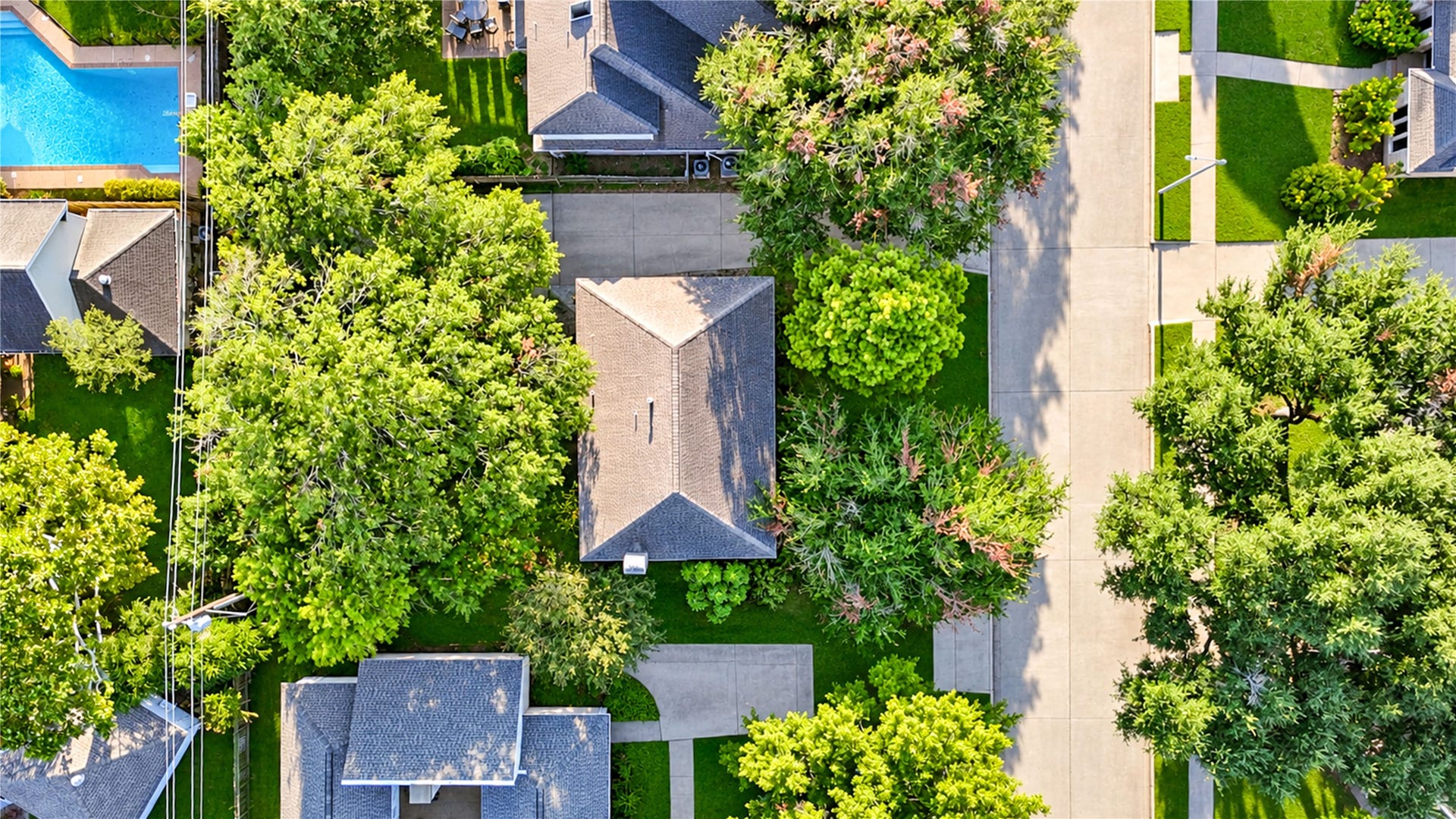 11423 Inwood Drive, Houston, TX 77077 A beautiful perspective from above! Surrounded by mature trees and lush greenery, this Village West home offers a peaceful setting with a spacious backyard and inviting outdoor living areas. The aerial view highlights the home's established neighborhood charm, where tree-lined streets and generous green spaces create a welcome escape from the everyday hustle. Enjoy the tranquility of neighborhood living in the heart of the Energy Corridor!