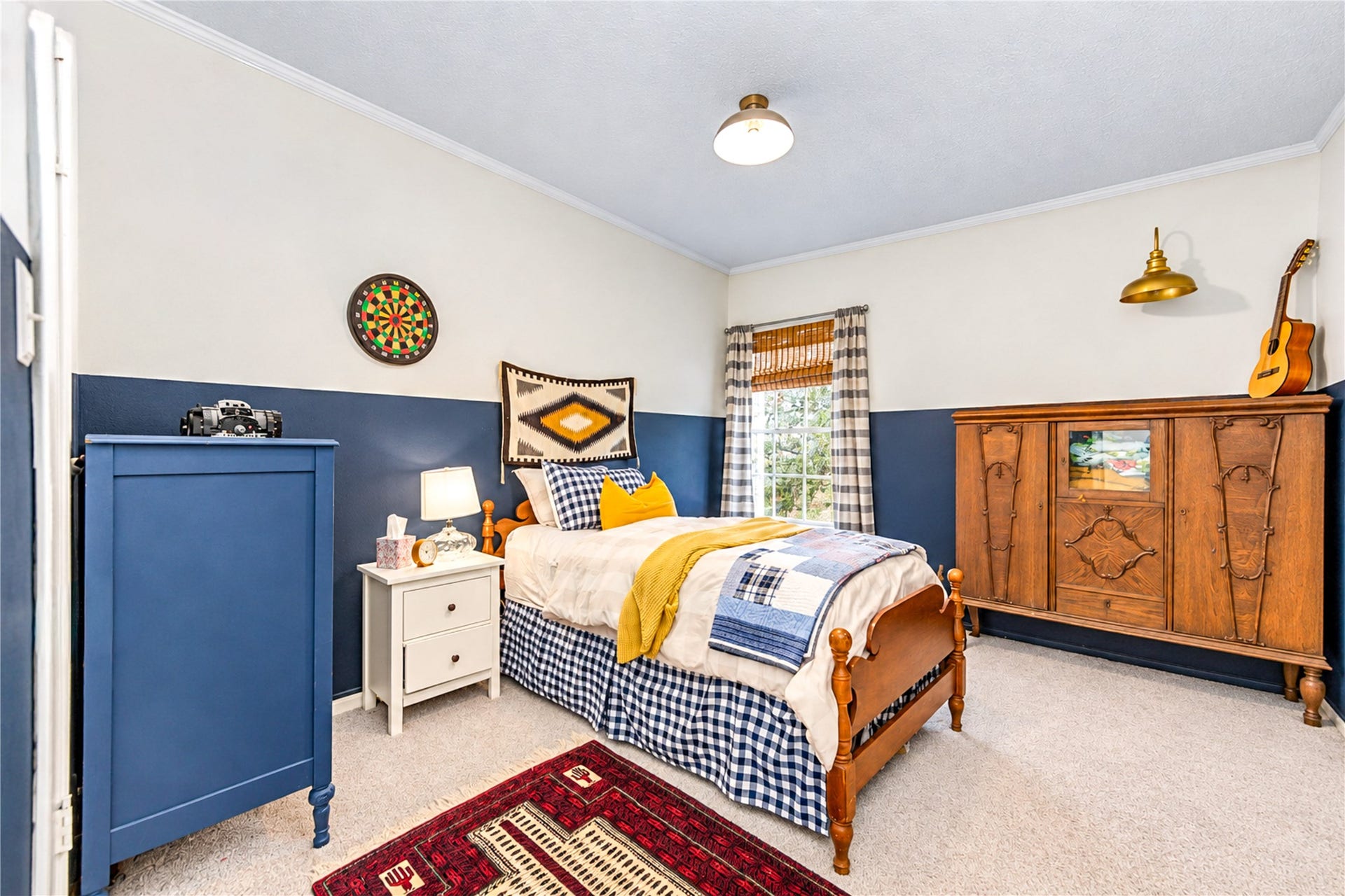 11423 Inwood Drive, Houston, TX 77077 Full of charm and personality! This inviting fourth bedroom features a beautiful blue accent wall, soft carpeting and warm natural light. Thoughtful designer details create a cozy, welcoming atmosphere, while the versatile layout offers endless possibilities as a guest retreat, creative space or additional bedroom. Another delightful example of the character and style found throughout this home!