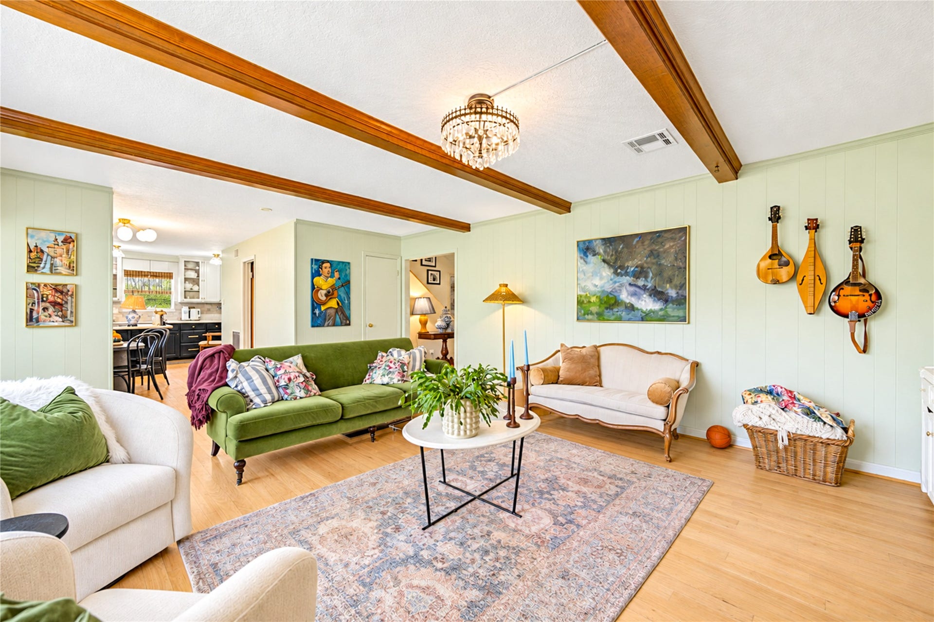 11423 Inwood Drive, Houston, TX 77077 Designed for connection and comfortable everyday living! Soaring ceilings with exposed wood beams add warmth and character to this spacious living room, while beautiful wood floors and abundant natural light create an inviting atmosphere. The seamless flow into the open kitchen makes entertaining effortless, whether hosting lively gatherings, sharing casual conversations while preparing dinner or simply enjoying time at home. A perfect blend of style, comfort and functionality!