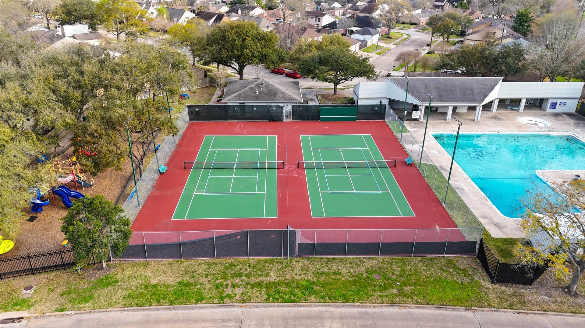 11423 Inwood Drive, Houston, TX 77077 Game, set, match! Enjoy an active lifestyle right in your own Village West community with neighborhood tennis courts and a sparkling swimming pool just steps apart. Whether you're starting the morning with a friendly match, cooling off on a warm Houston afternoon or connecting with neighbors, these inviting recreational amenities make it easy to enjoy the outdoors. Another wonderful perk of living in this established Energy Corridor neighborhood!