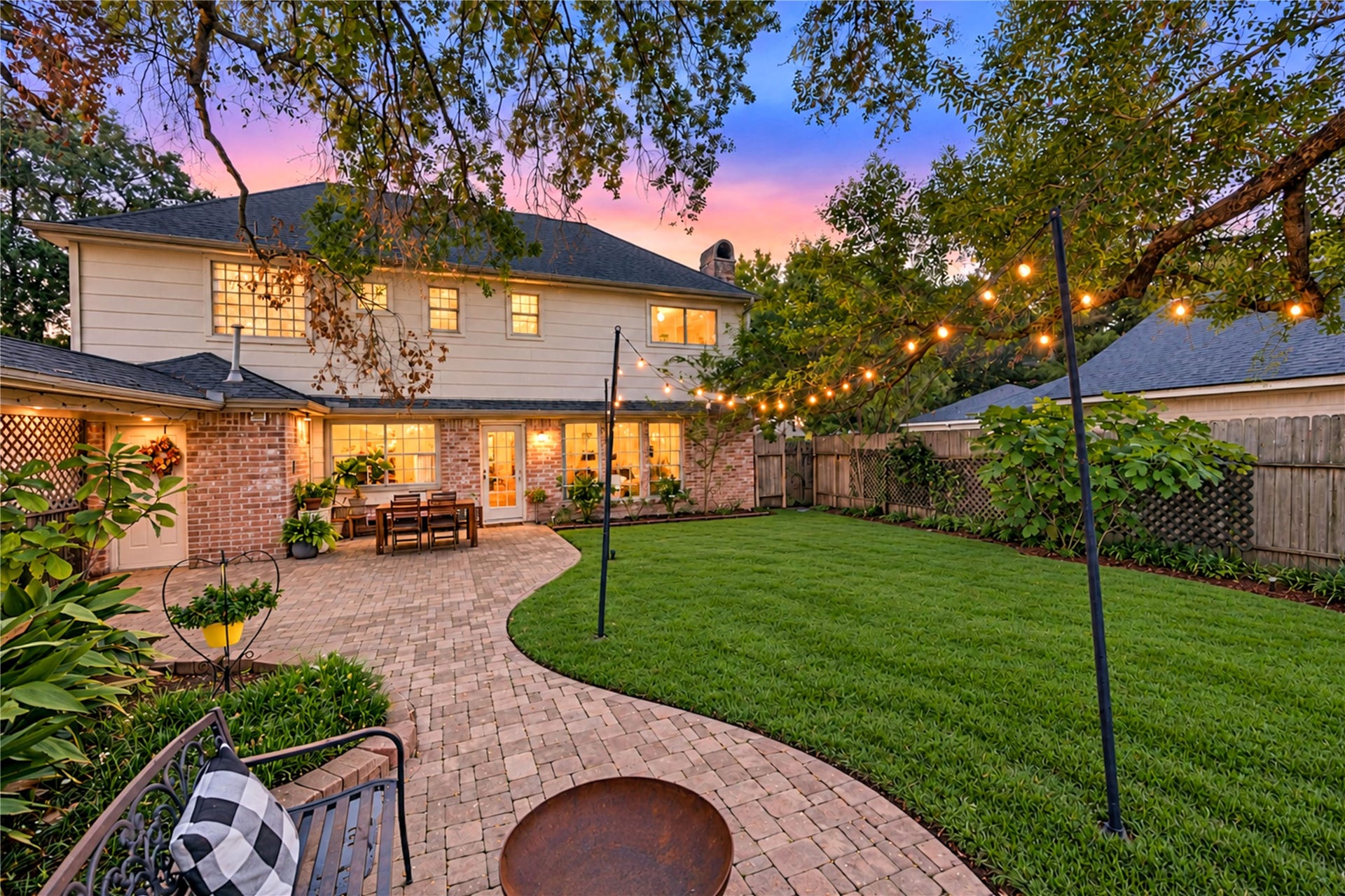 11423 Inwood Drive, Houston, TX 77077 An outdoor retreat designed for making memories! This expansive fenced backyard offers a beautiful blend of lush green lawn, mature shade trees and an impressive brick paver patio. Imagine weekend cookouts, outdoor games, leisurely afternoons in the shade and magical evenings gathered with friends beneath the sunset sky. With room to entertain, play or simply unwind, this backyard brings the best of outdoor living right to your doorstep!