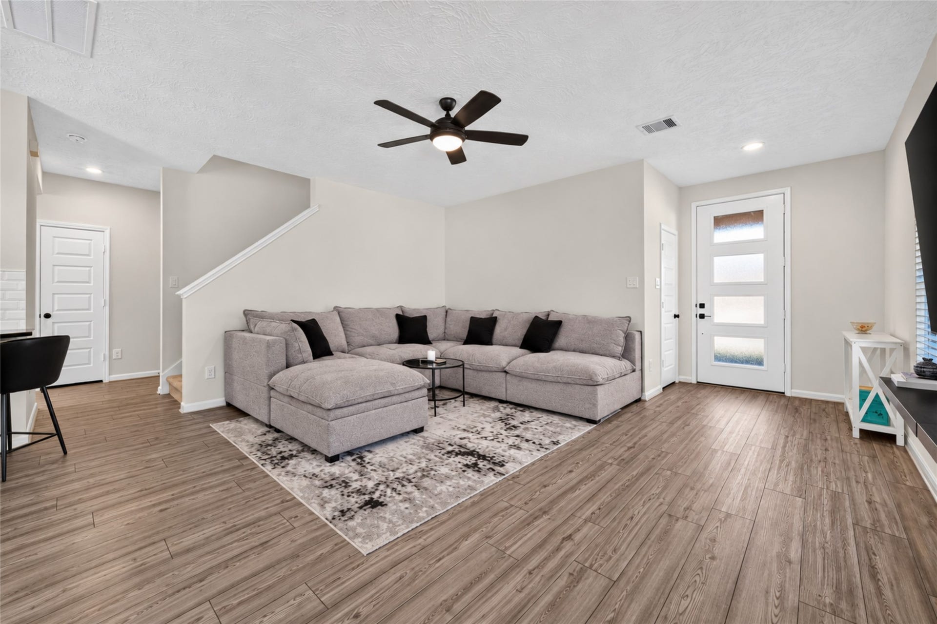 9453 Castillo Court, Magnolia, TX 77354 Imagine settling into this comfortable living room after a busy day. The open layout, natural light, and attractive flooring create an inviting setting for relaxation and entertainment.