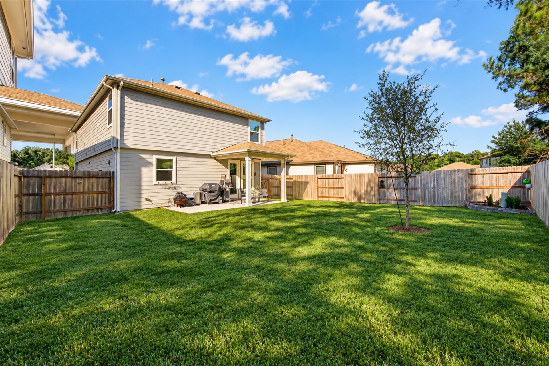 9453 Castillo Court, Magnolia, TX 77354 Enjoy the best of outdoor living with an extended covered patio overlooking the spacious fenced backyard.