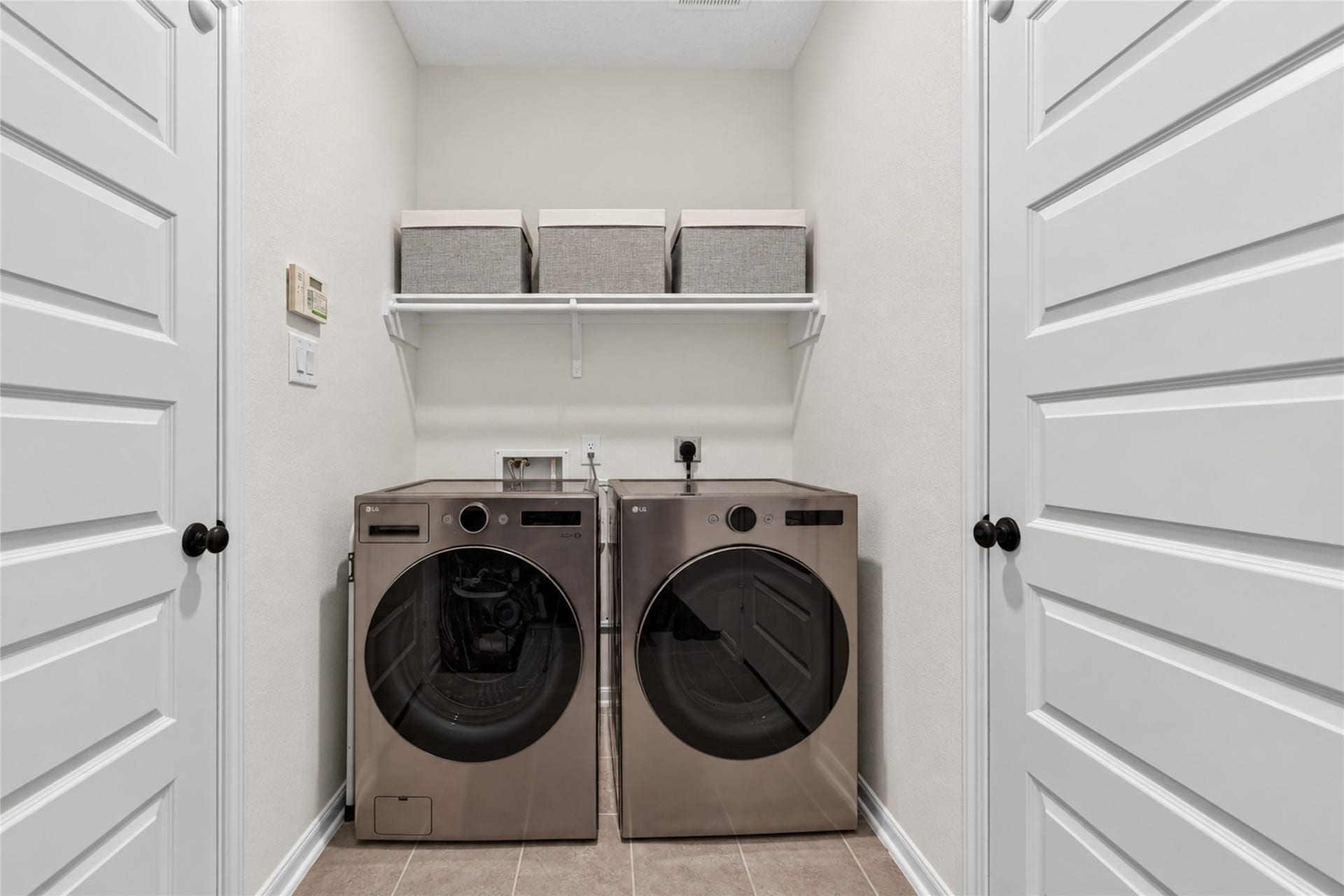 9453 Castillo Court, Magnolia, TX 77354 Make everyday routines more convenient with a dedicated laundry space featuring overhead shelving. The practical layout offers room to organize laundry supplies and keep essentials within easy reach.
