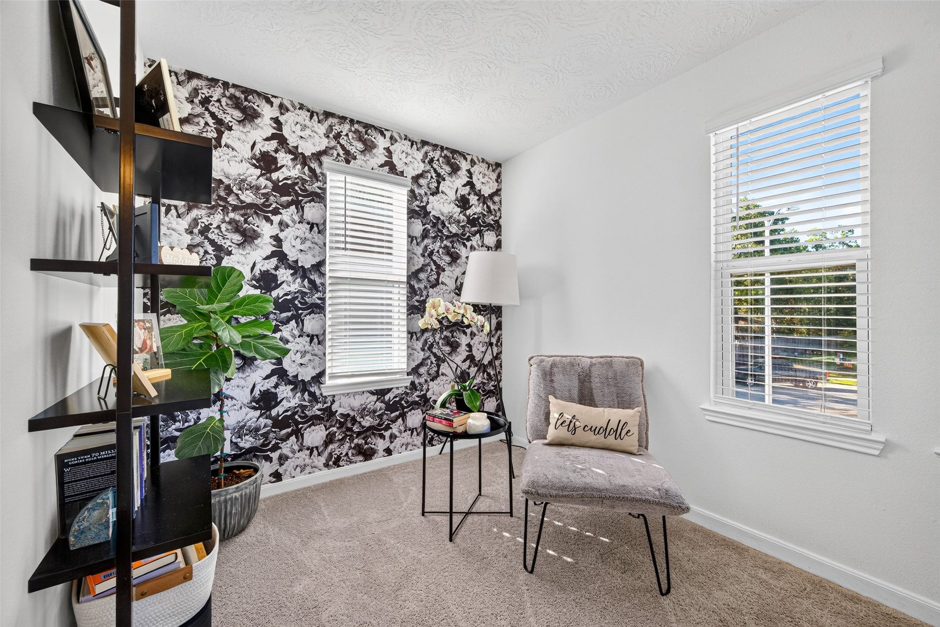 9453 Castillo Court, Magnolia, TX 77354 Discover a charming sitting area within the primary suite, complete with natural light and a decorative accent wall. Imagine transforming this space into a reading nook, relaxation corner, or personal retreat.