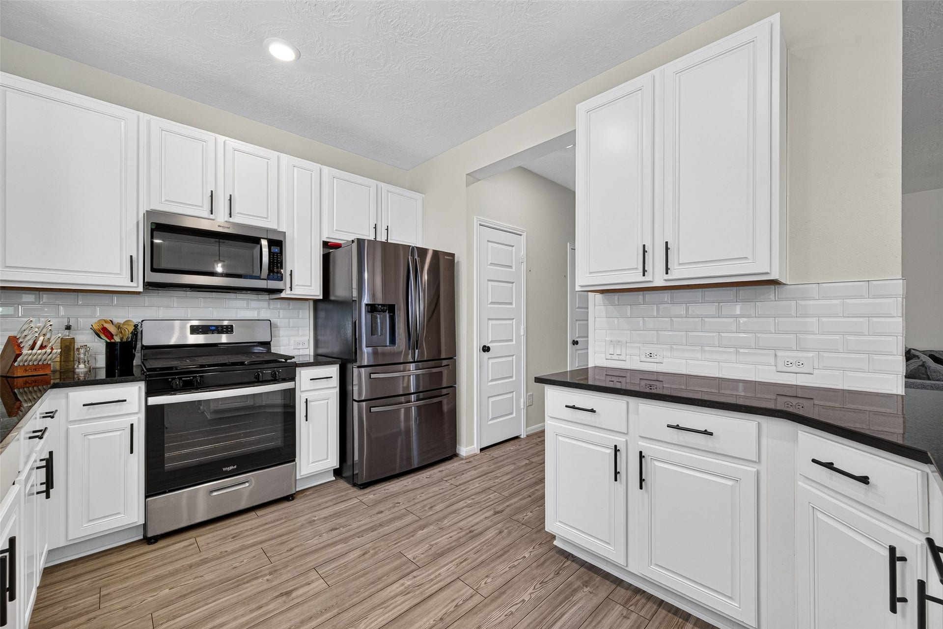 9453 Castillo Court, Magnolia, TX 77354 Preparing meals is a breeze with a gas range, built-in microwave, and ample counter space. Bright cabinetry and coordinated finishes create a warm, inviting kitchen, perfect for quick breakfasts or memorable dinners.