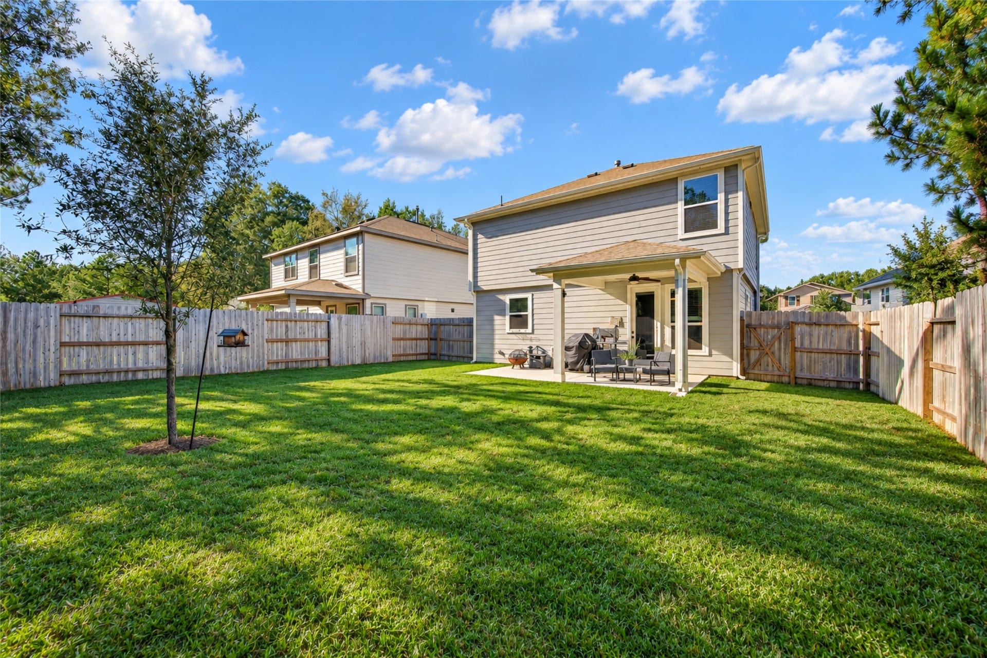 9453 Castillo Court, Magnolia, TX 77354 The open lawn provides flexibility for gardening, outdoor activities, or simply enjoying the fresh air.