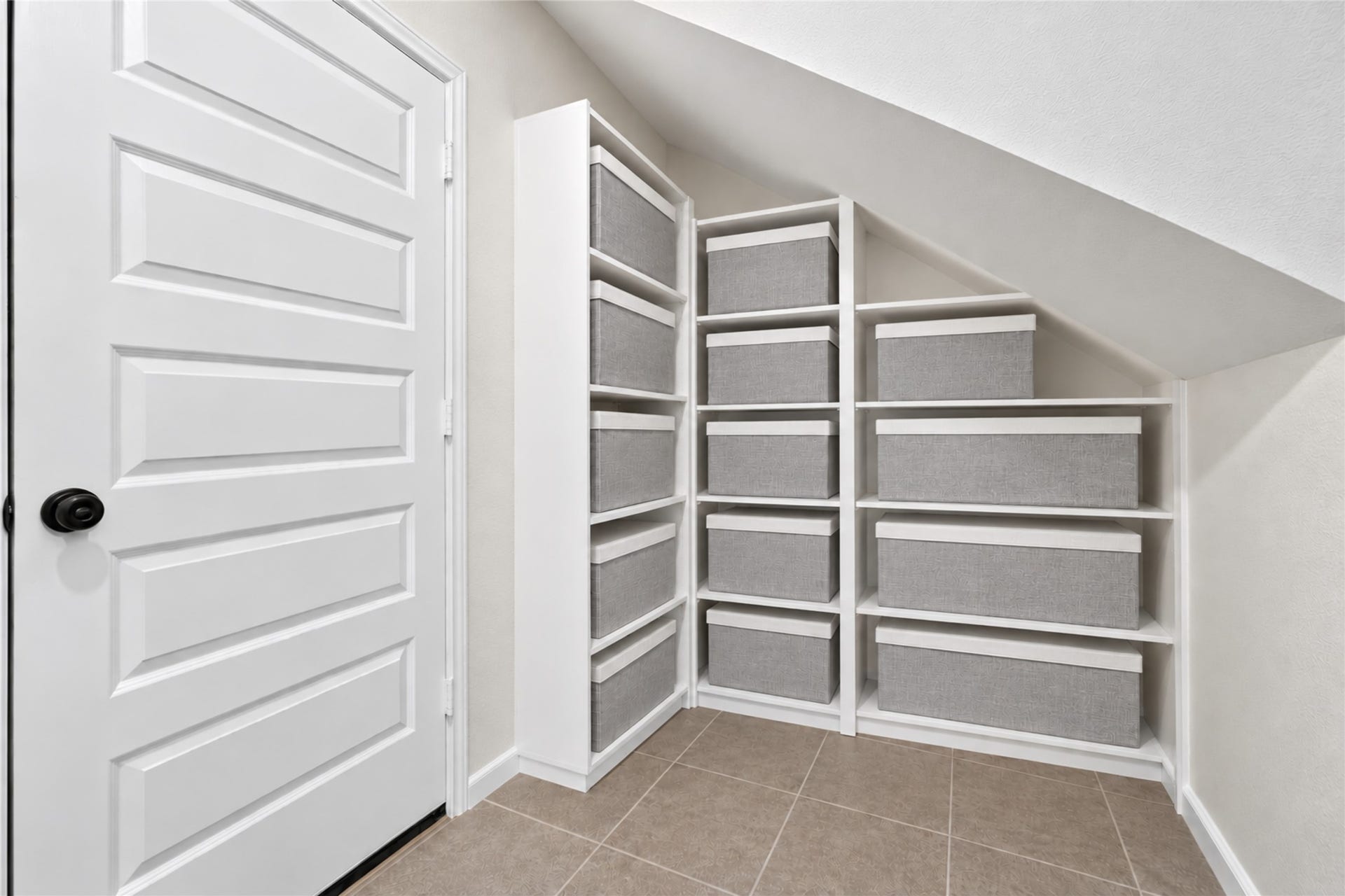 9453 Castillo Court, Magnolia, TX 77354 Enjoy the convenience of additional storage tucked neatly beneath the staircase. Built-in shelving provides an organized place for household essentials while keeping the main living areas clutter-free.