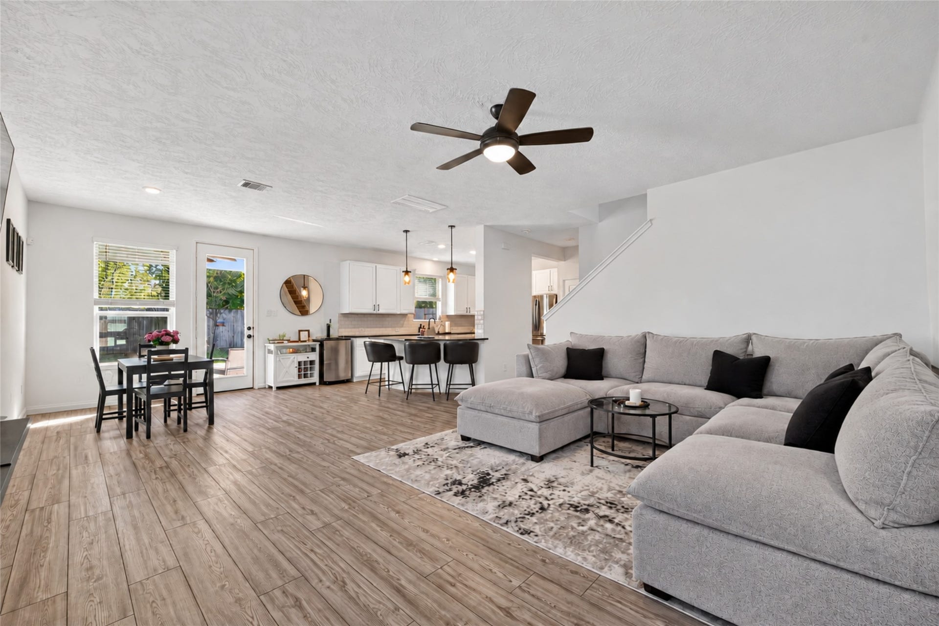 9453 Castillo Court, Magnolia, TX 77354 Experience the comfort of open-concept living with beautiful luxury vinyl plank flooring and abundant natural light. Whether enjoying a quiet evening or entertaining guests, this inviting living space offers room to relax and connect.