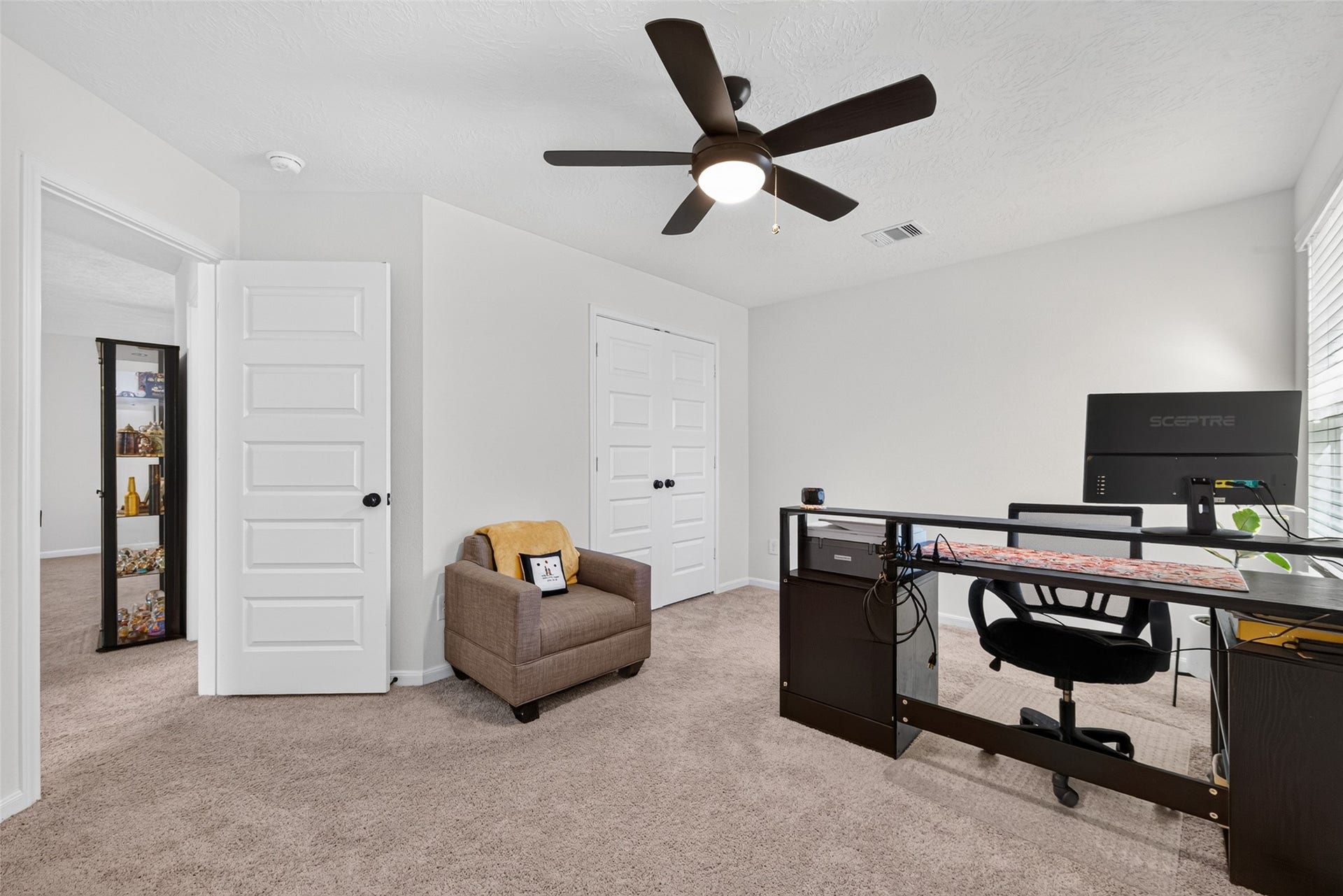 9453 Castillo Court, Magnolia, TX 77354 This versatile secondary bedroom is currently being used as a home office, showcasing its flexibility to accommodate your lifestyle. Whether you need a comfortable bedroom, a dedicated workspace, or a creative retreat, this space offers plenty of possibilities.
