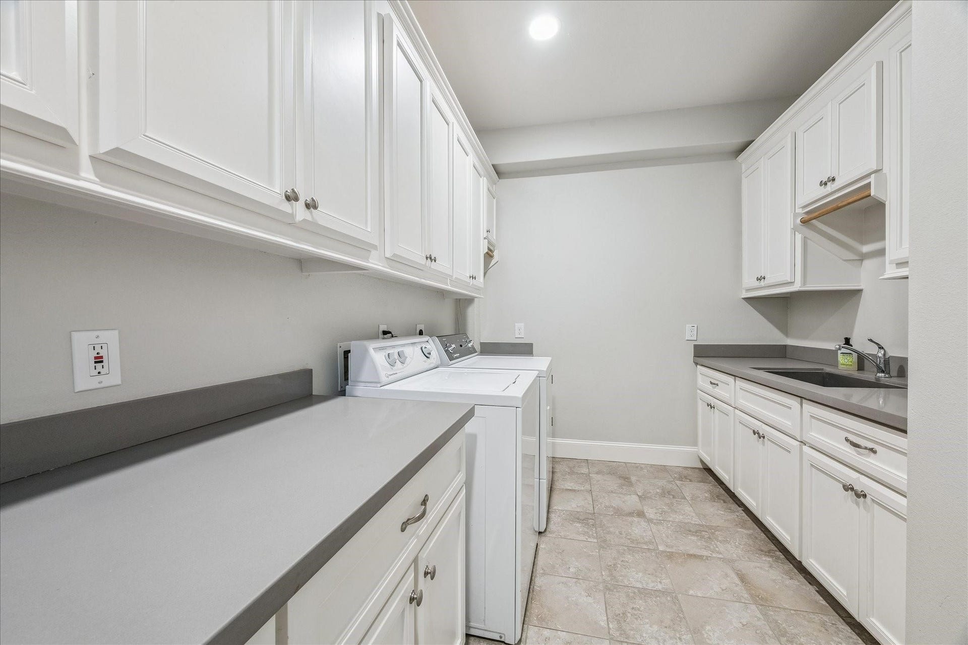 209 Queen Road, Clear Lake Shores, TX 77565 This laundry room has it all with tons of cabinetry, large undermount utility sink, hanging rod, folding counter and the washer and dryer are included