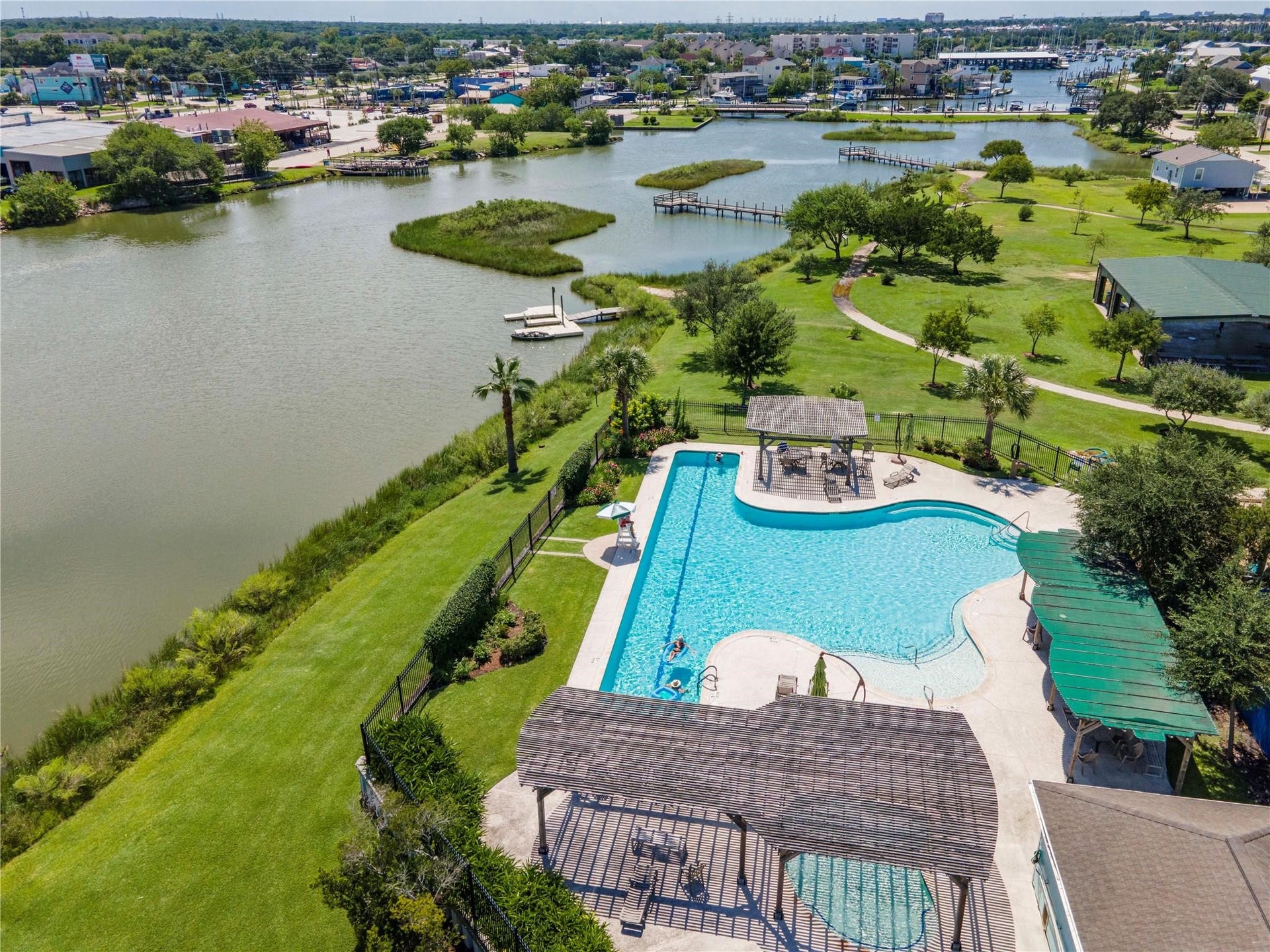 209 Queen Road, Clear Lake Shores, TX 77565 Community pool, pavilion, and nature park all with waterfront views