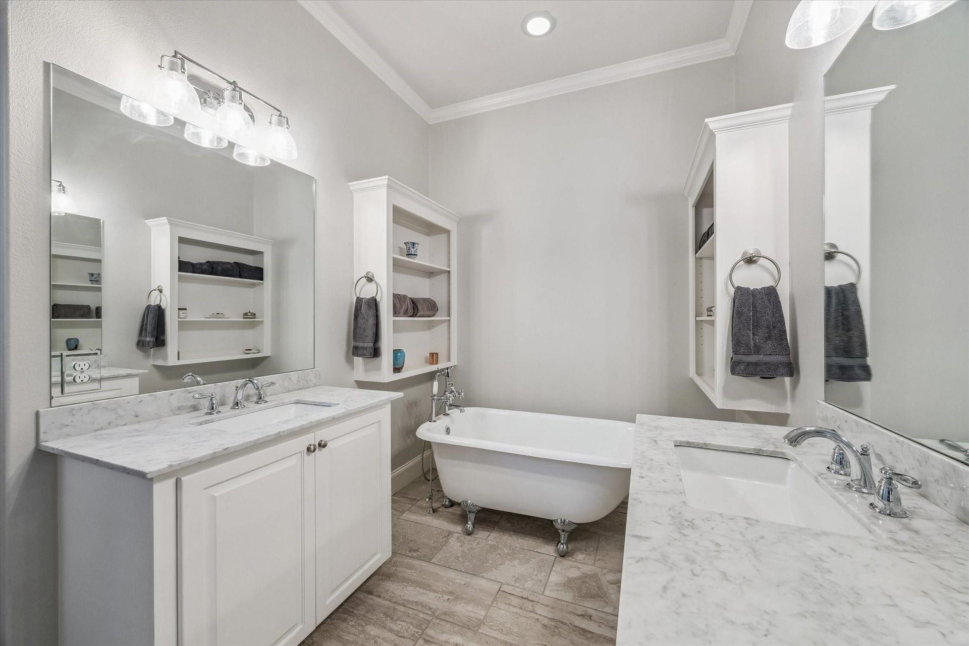 209 Queen Road, Clear Lake Shores, TX 77565 The neutral color palette and modern fixtures create a serene, spa-like atmosphere.